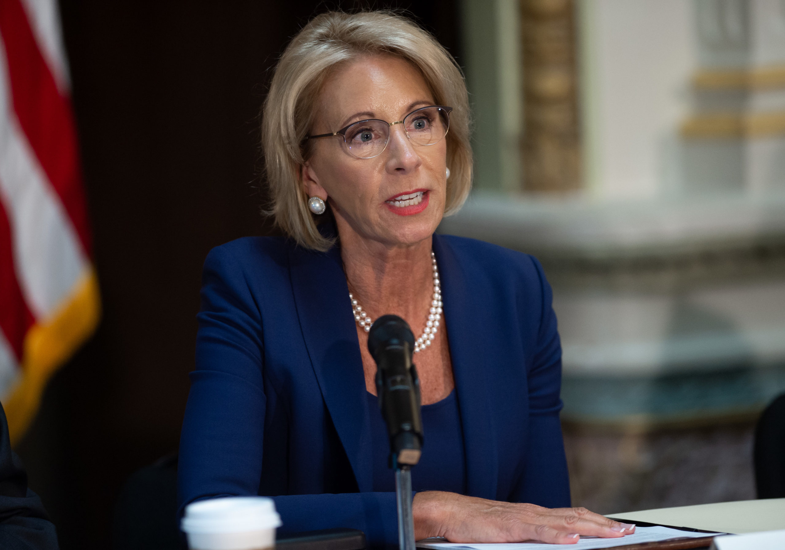 US Secretary of Education Betsy DeVos speaks during the fifth meeting of the Federal Commission on School Safety, focusing on the best practices for school building security, active shooter training for schools and practitioner experience with school-based threat assessment, in the Eisenhower Executive Office Building, adjacent to the White House in Washington, DC, August 16, 2018. (Photo by SAUL LOEB / AFP) (Photo credit should read SAUL LOEB/AFP via Getty Images)