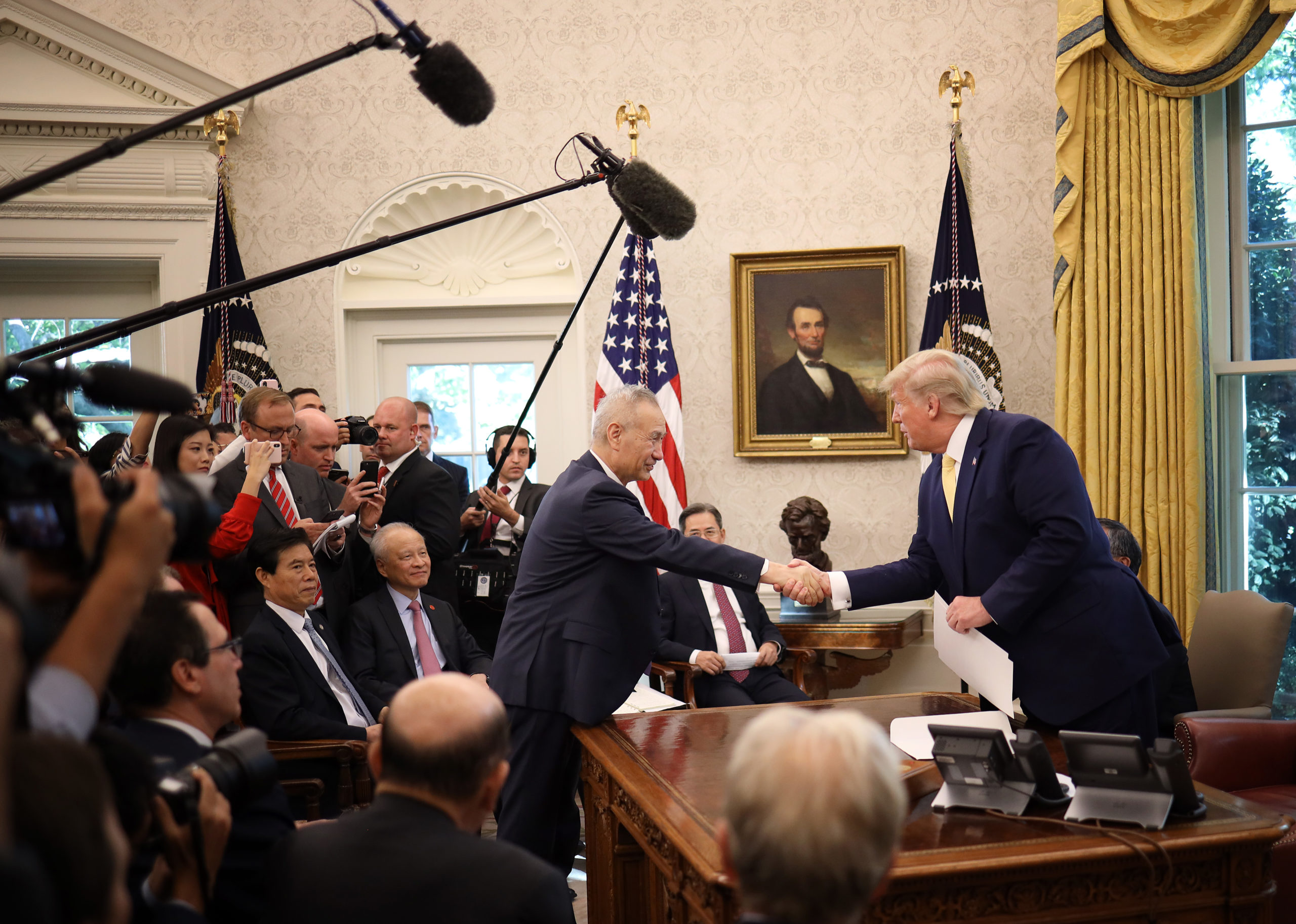 President Donald Trump shakes hands with Chinese Vice Premier Liu He after announcing a "phase one" trade agreement with China in 2019. (Win McNamee/Getty Images)