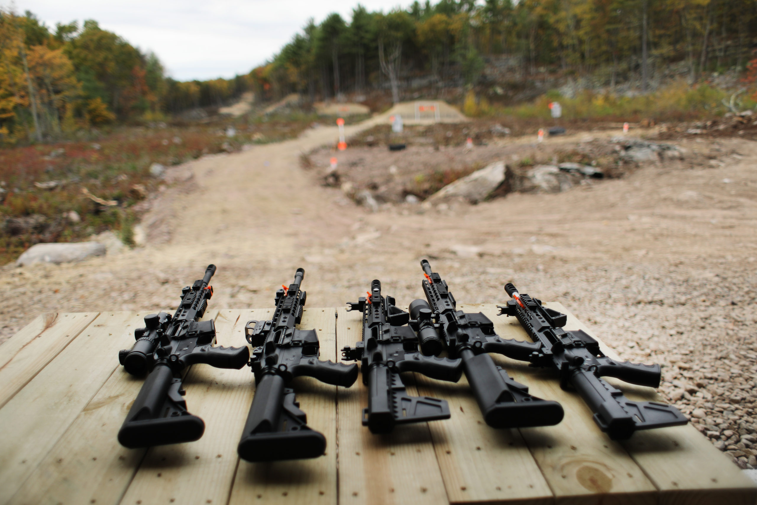 GREELEY, PENNSYLVANIA - OCTOBER 12: AR-15 rifles and other weapons are displayed on a table at a shooting range during the “Rod of Iron Freedom Festival” on October 12, 2019 in Greeley, Pennsylvania. The two-day event, which is organized by Kahr Arms/Tommy Gun Warehouse and Rod of Iron Ministries, has billed itself as a “second amendment rally and celebration of freedom, faith and family.” Numerous speakers, vendors and displays celebrated guns and gun culture in America. (Spencer Platt/Getty Images)