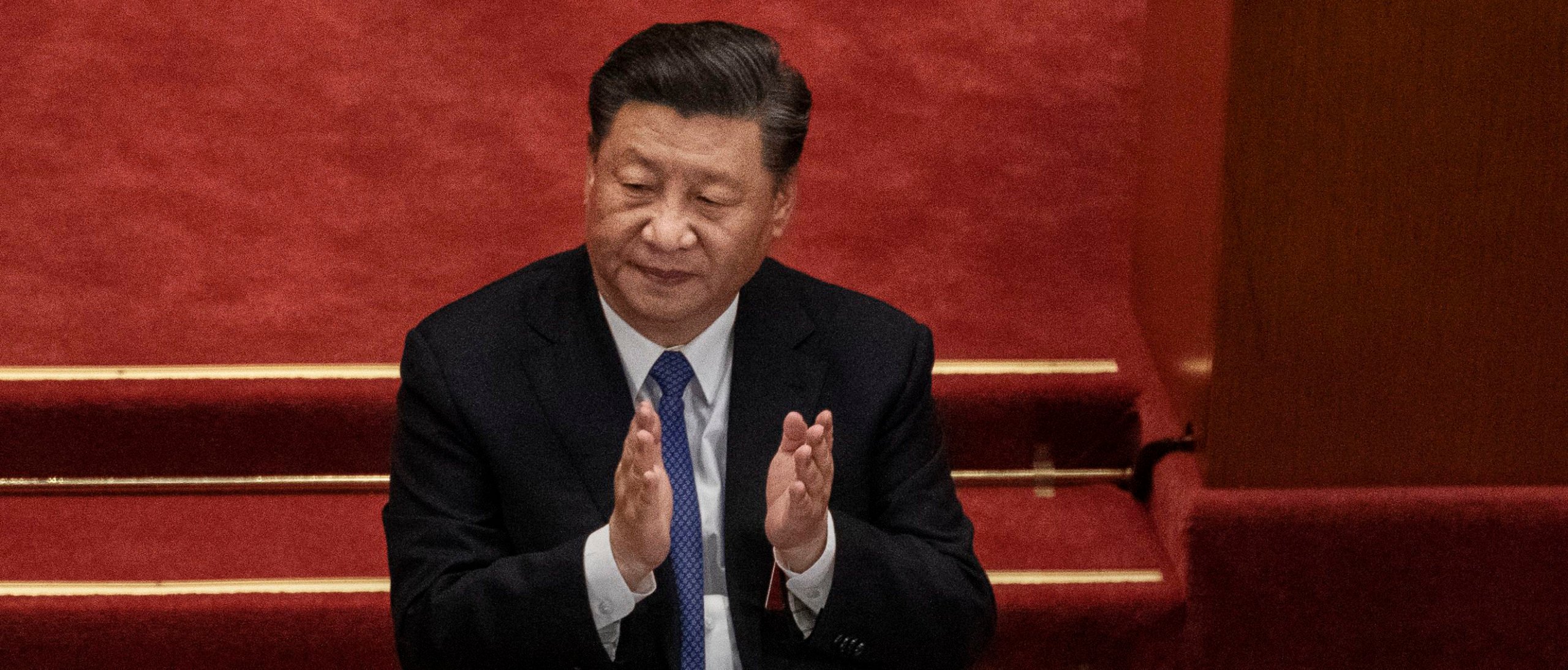 BEIJING, CHINA - MAY 28: Chinese president Xi Jinping, applauds the results of a vote on a new draft security bill for Hong Kong during the closing session of the National People's Congress at the Great Hall of the People on May 28, 2020 in Beijing, China. (Photo by Kevin Frayer/Getty Images)