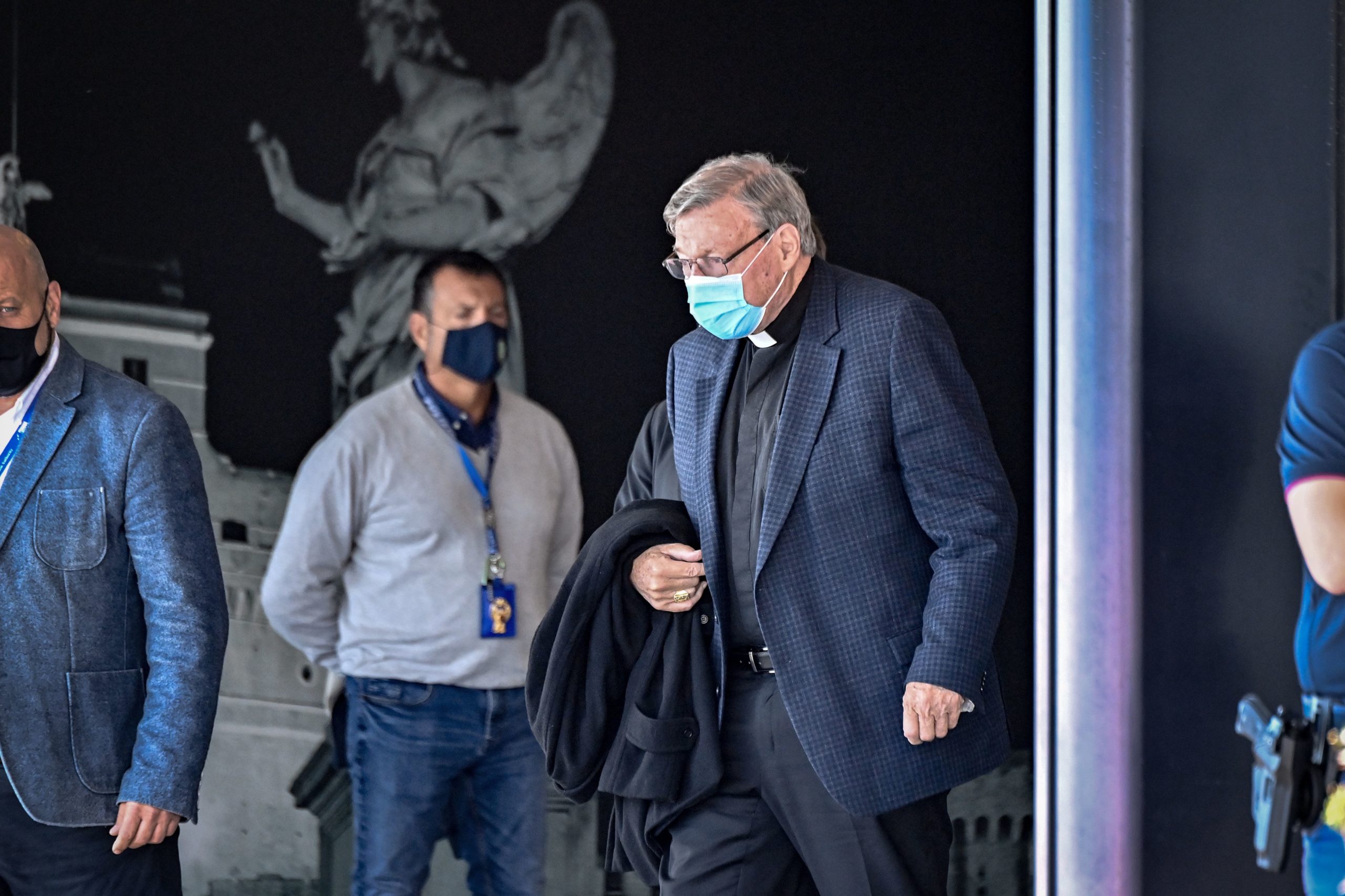 Australian Cardinal George Pell prepares to get into a car after landing at Rome's Fiumicino airport on Sept. 30, returning for the first time since being acquitted of sexual abuse charges. (Alberto Pizzoli/AFP via Getty Images)