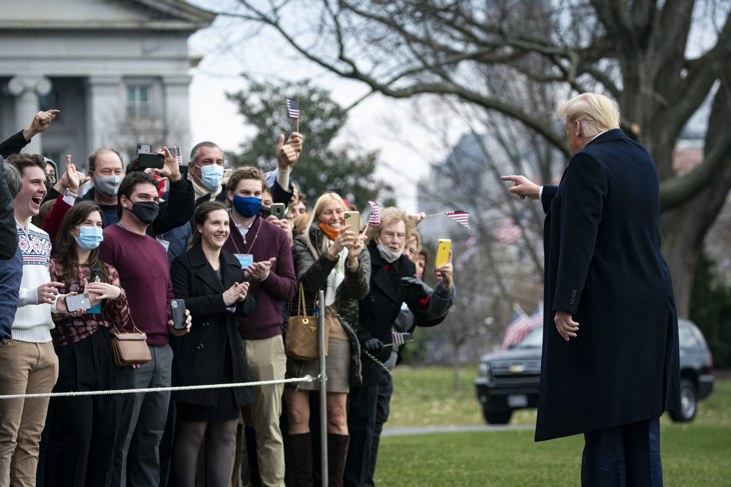 WASHINGTON, DC - DECEMBER 12: U.S. President Donald Trump greets visitors as he departs on the South Lawn of the White House, on December 12, 2020 in Washington, DC. Trump is traveling to the Army versus Navy Football Game at the United States Military Academy in West Point, NY. (Photo by Al Drago/Getty Images)