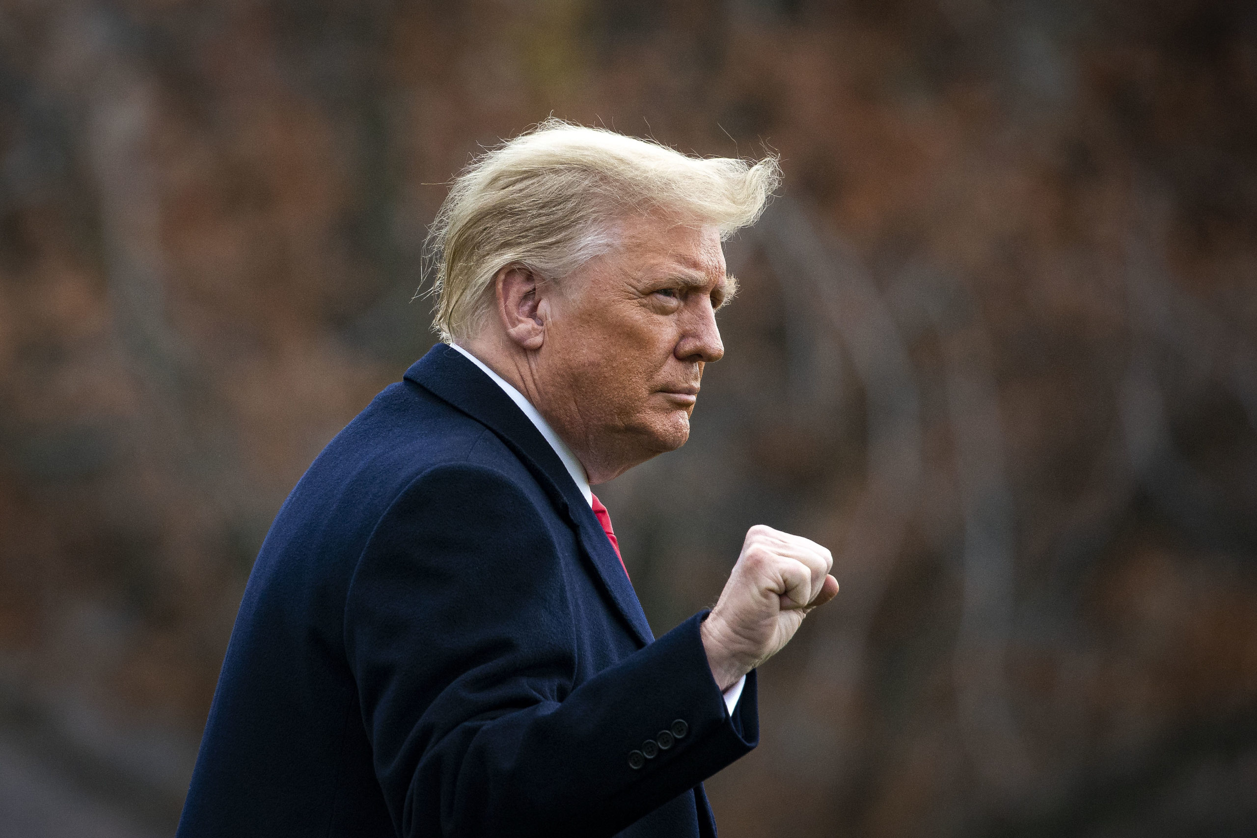 WASHINGTON, DC - DECEMBER 12: U.S. President Donald Trump pumps his fist as he departs on the South Lawn of the White House, on December 12, 2020 in Washington, DC. Trump is traveling to the Army versus Navy Football Game at the United States Military Academy in West Point, NY. (Photo by Al Drago/Getty Images)