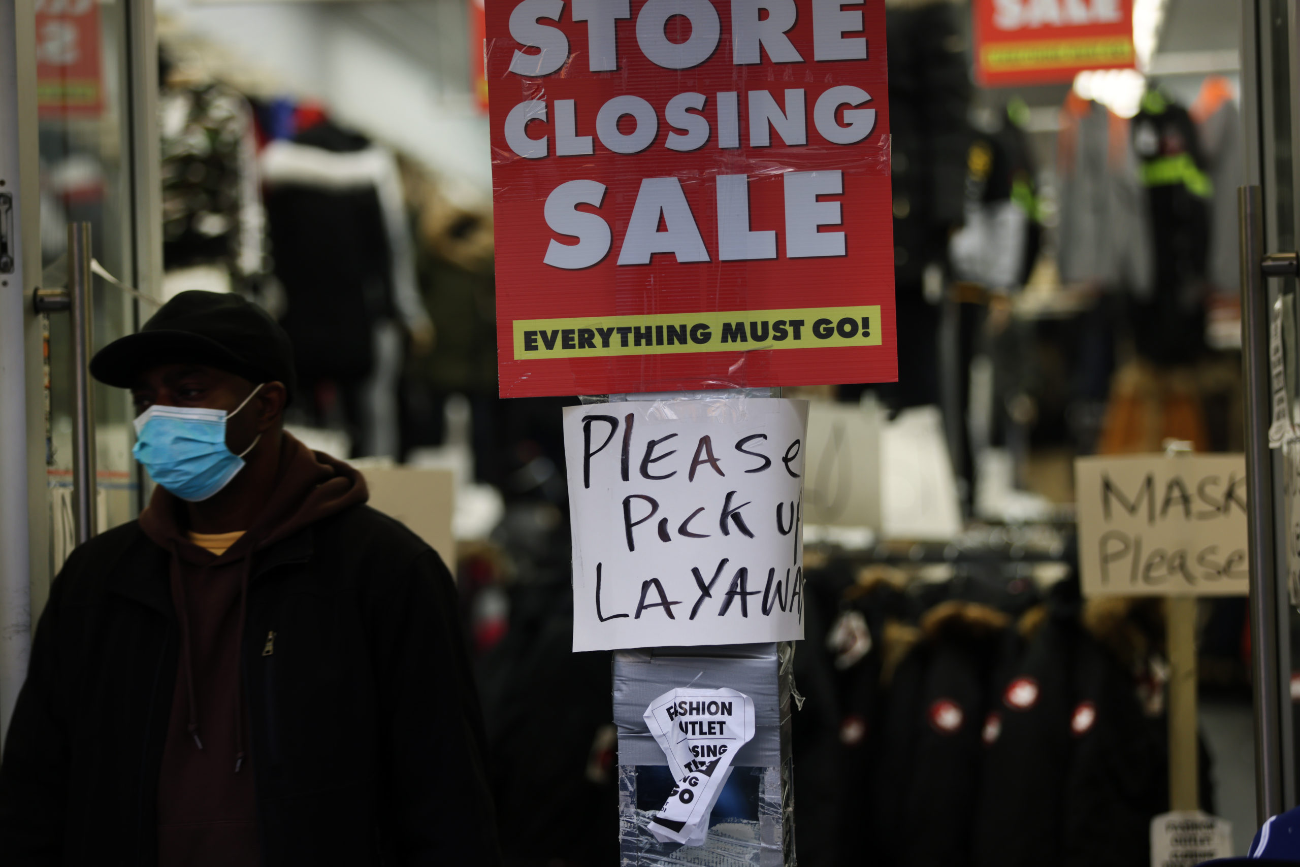 Sale signs are displayed in the window of a Brooklyn, New York on Dec. 1. (Spencer Platt/Getty Images)