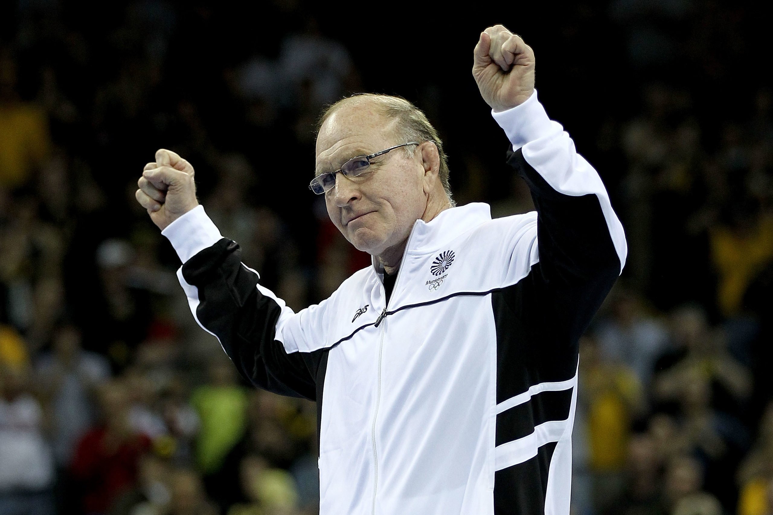 IOWA CITY, IA - APRIL 21: Dan Gable acknowledges the crowd after being introduced as part of the 1972 Olympic team during the finals of the US Wrestling Olympic Trials at Carver Hawkeye Arena on April 21, 2012 in Iowa City, Iowa. (Photo by Matthew Stockman/Getty Images)