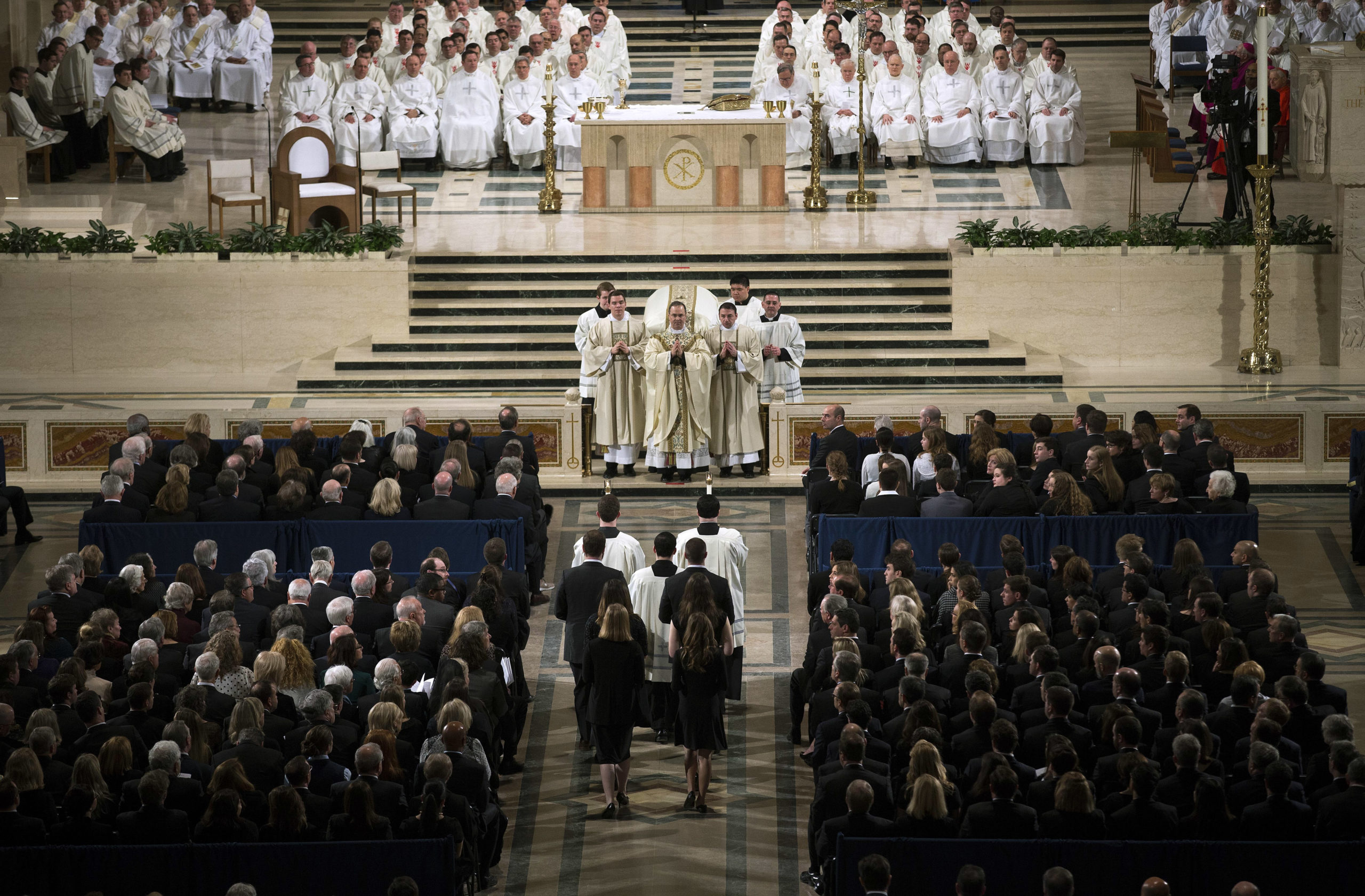 Father Paul Scalia, son of Justice Antonin Scalia, leads the funeral Mass for Associate Justice Antonin Scalia at the Basilica of the National Shrine of the Immaculate Conception February 20, 2016 in Washington, DC. Scalia, who died February 13 while on a hunting trip in Texas, layed in repose in the Great Hall of the Supreme Court on Friday and his funeral service will be at the basillica today. (Photo by Doug Mills-Pool/Getty Images)