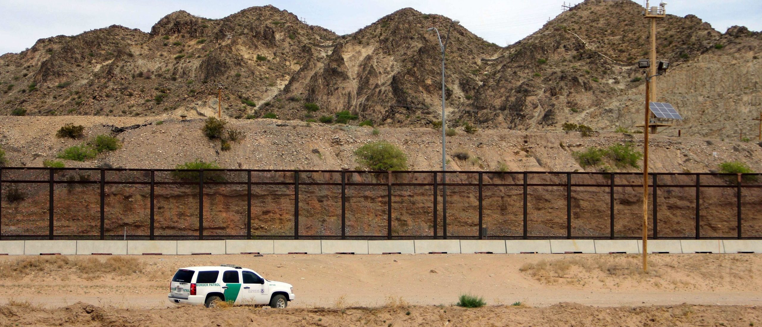 A US Border Patrol is seen from Mexico while patrolling along the border line between the cities of El Paso, Texas, in the United States, and Ciudad Juarez, Chihuahua state, Mexico on April 7, 2018. The US states of Texas and Arizona on Friday announced plans to send National Guard troops to the southern border with Mexico after President Donald Trump ordered a thousands-strong deployment to combat drug trafficking and illegal immigration. / AFP PHOTO / HERIKA MARTINEZ (Photo credit should read HERIKA MARTINEZ/AFP via Getty Images)
