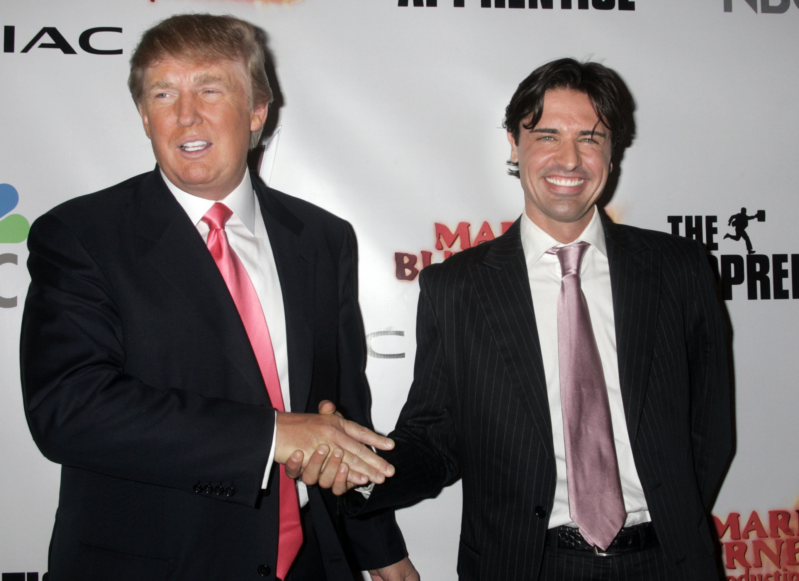 Donald Trump (L), entrepreneur and host of the television reality series "The Apprentice", congratulates the winner of season five of "The Apprentice", Sean Yazbeck, at the party following the live telecast in Los Angeles, California June 5, 2006.