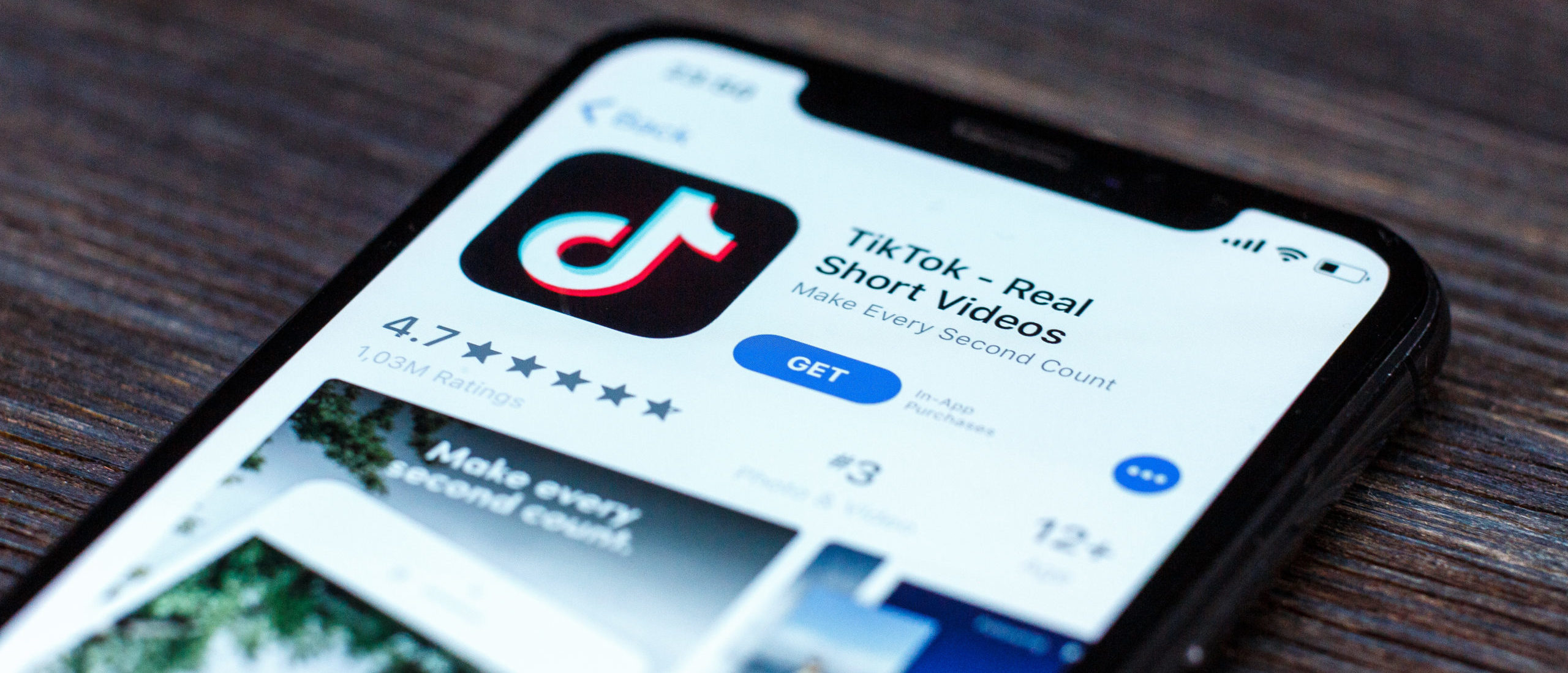 Tik Tok application icon on Apple iPhone X screen close-up. By XanderSt. Shutterstock.