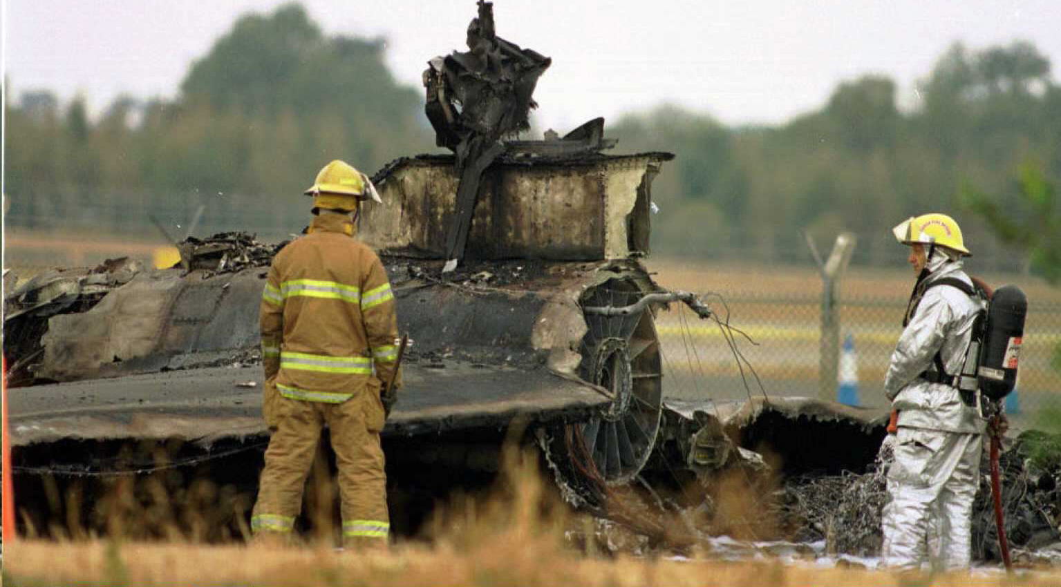US Air Force firecrews survey the wreckage of the U2 reconnaissance plane, which crashed during take-off 29 August from the former US Air Force base at Fairford, 70 miles west of London. (STR/AFP via Getty Images)