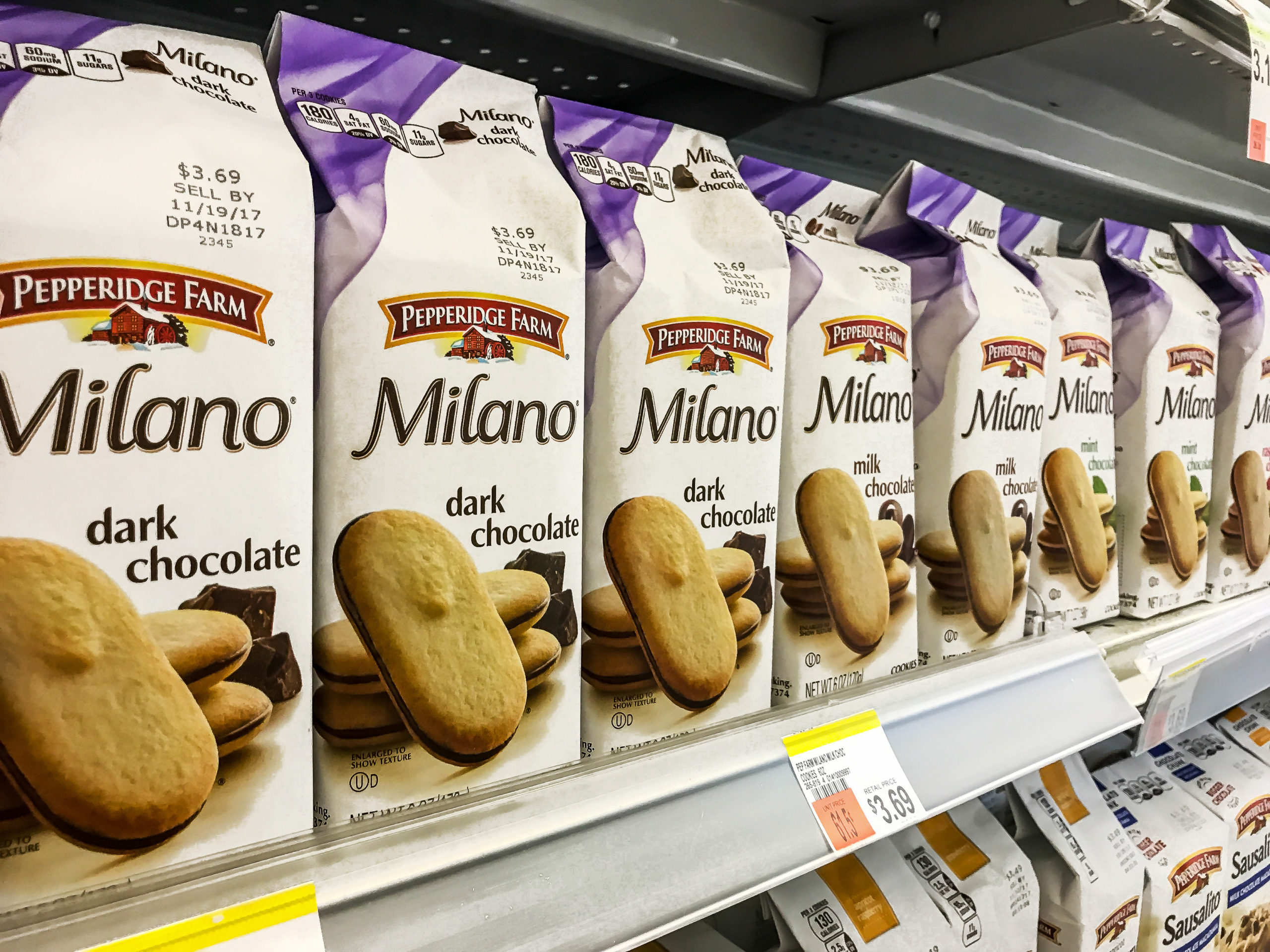 Packages of Milano chocolate cookies stand on a supermarket shelf. (Shutterstock/Roman Tiraspolsky)
