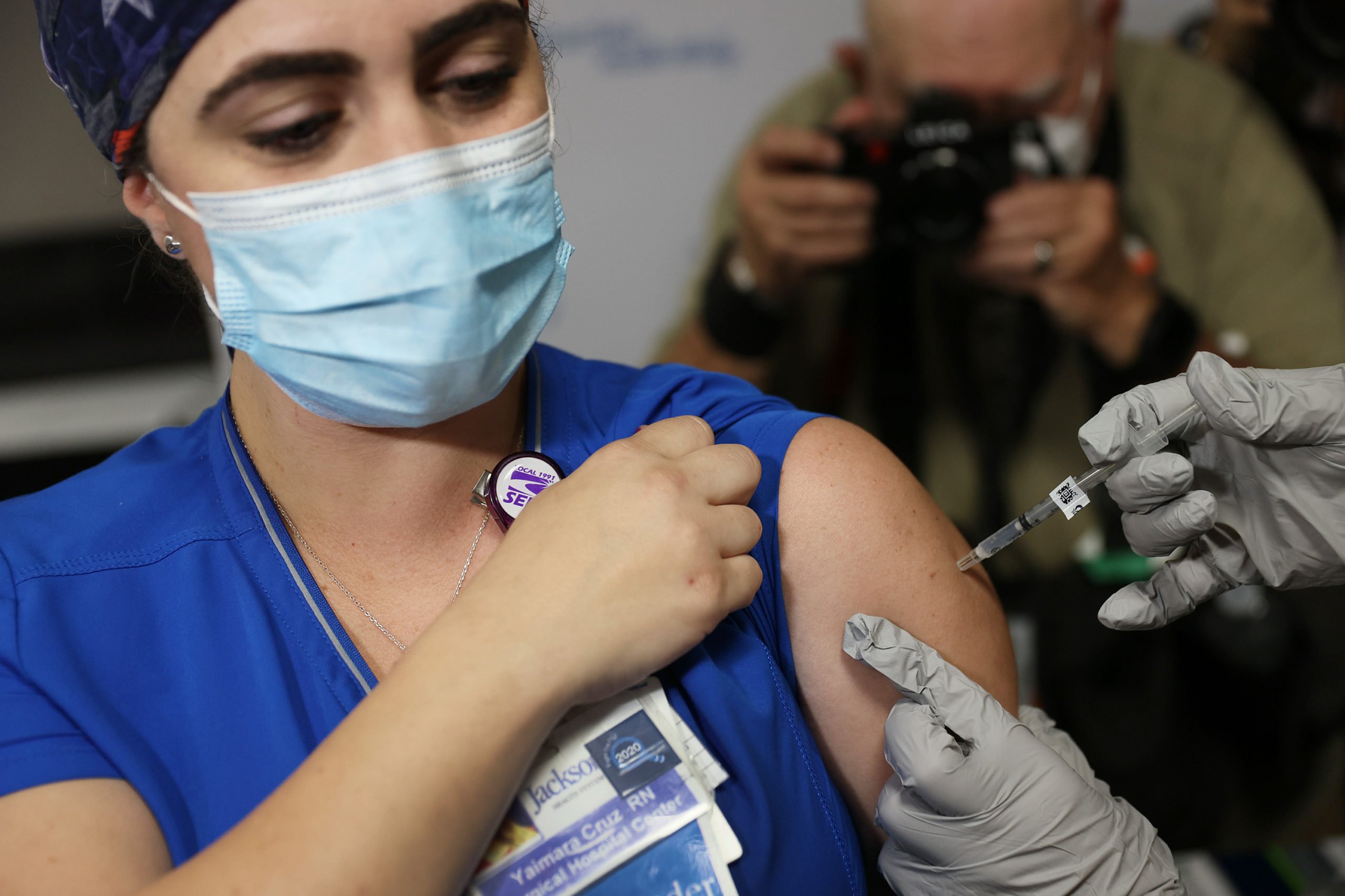RN from Jackson Health Systems, receives a Pfizer-BioNtech COVID-19 vaccine at the Jackson Memorial Hospital on December 15, 2020 in Miami, Florida. (Photo by Joe Raedle/Getty Images)