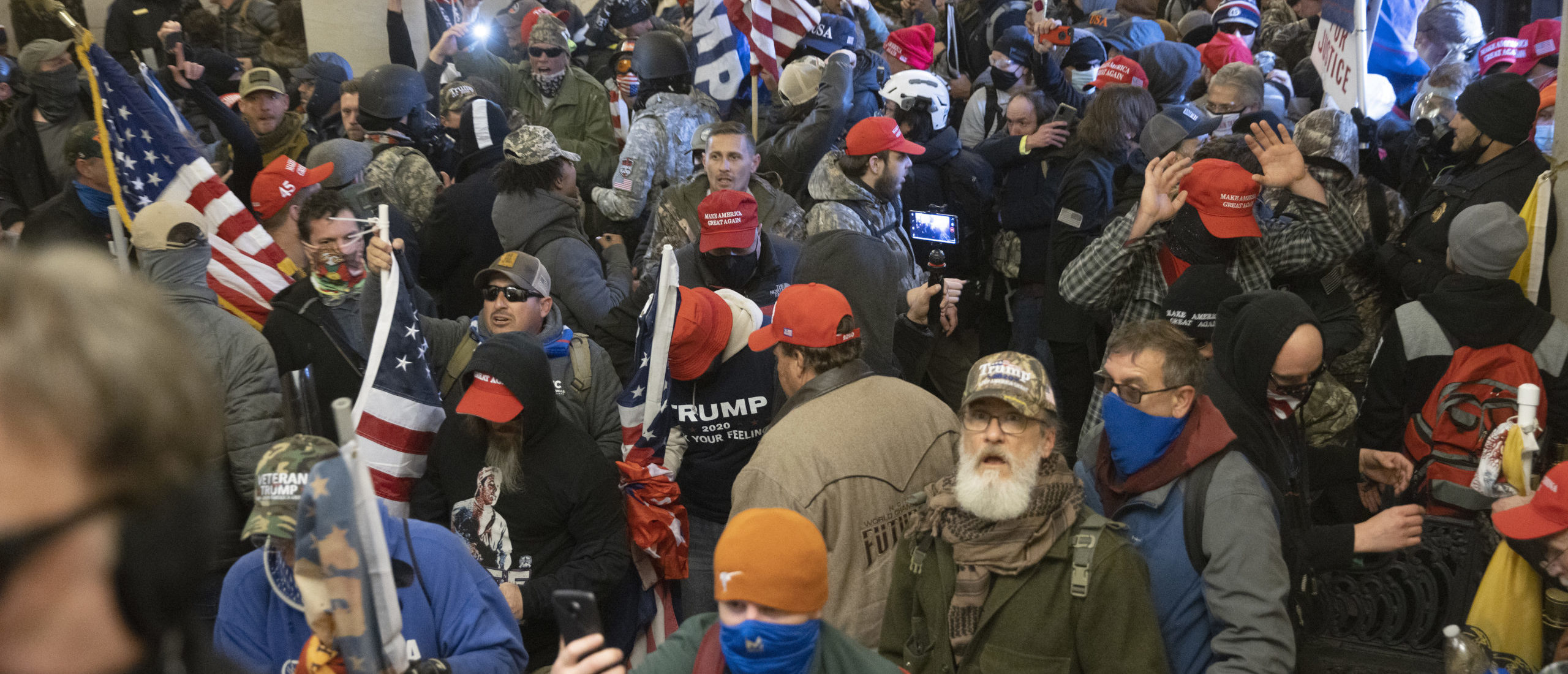 Protesters supporting U.S. President Donald Trump gather near the east front door of the U.S. Capitol after groups breached the building's security on January 06, 2021.