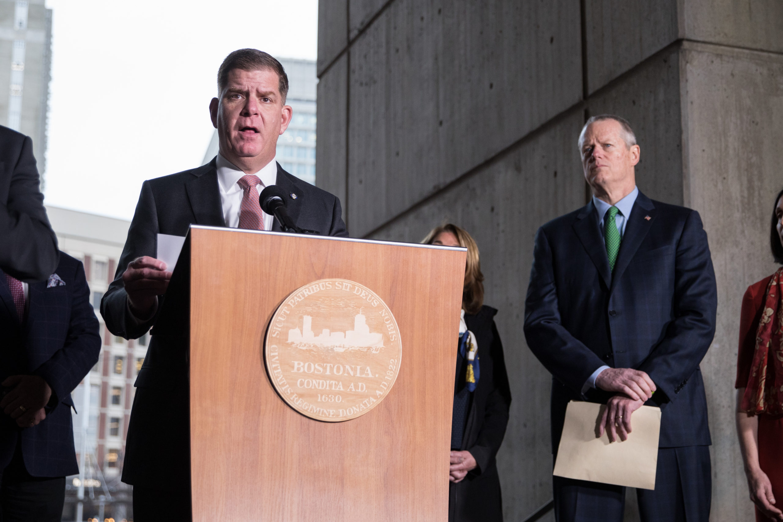 Boston Mayor Marty Walsh, joined by other officials, speaks at a press conference in March. (Scott Eisen/Getty Images)