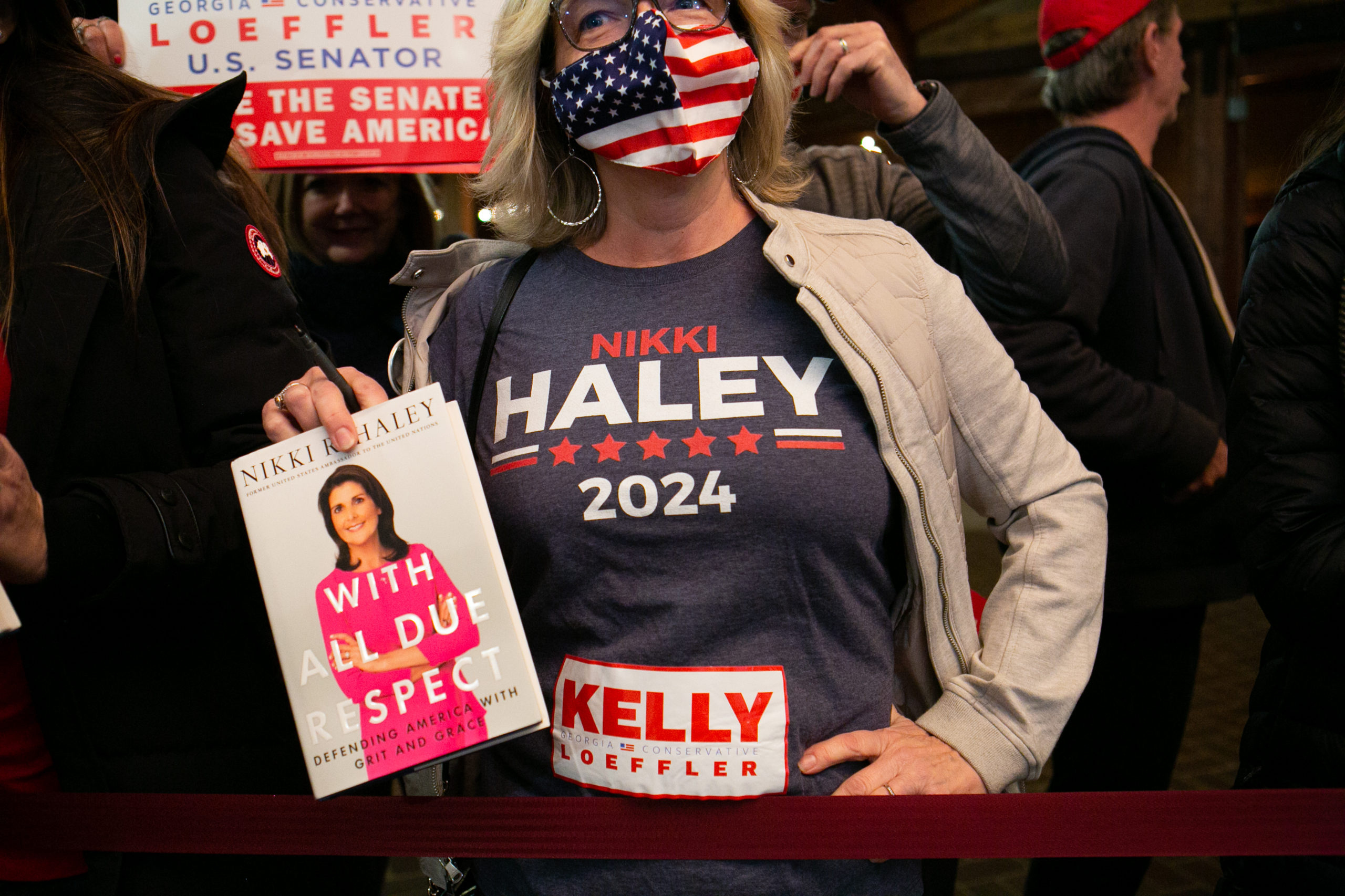 CUMMING, GA - DECEMBER 20: Tana Wagner waits to have her book signed by former U.N. Ambassador Nikki Haley during a campaign rally in support of Georgia Republican Senate candidates David Perdue (R-GA) and Kelly Loeffler (R-GA) on December 20, 2020 in Cumming, Georgia. (Photo by Jessica McGowan/Getty Images)