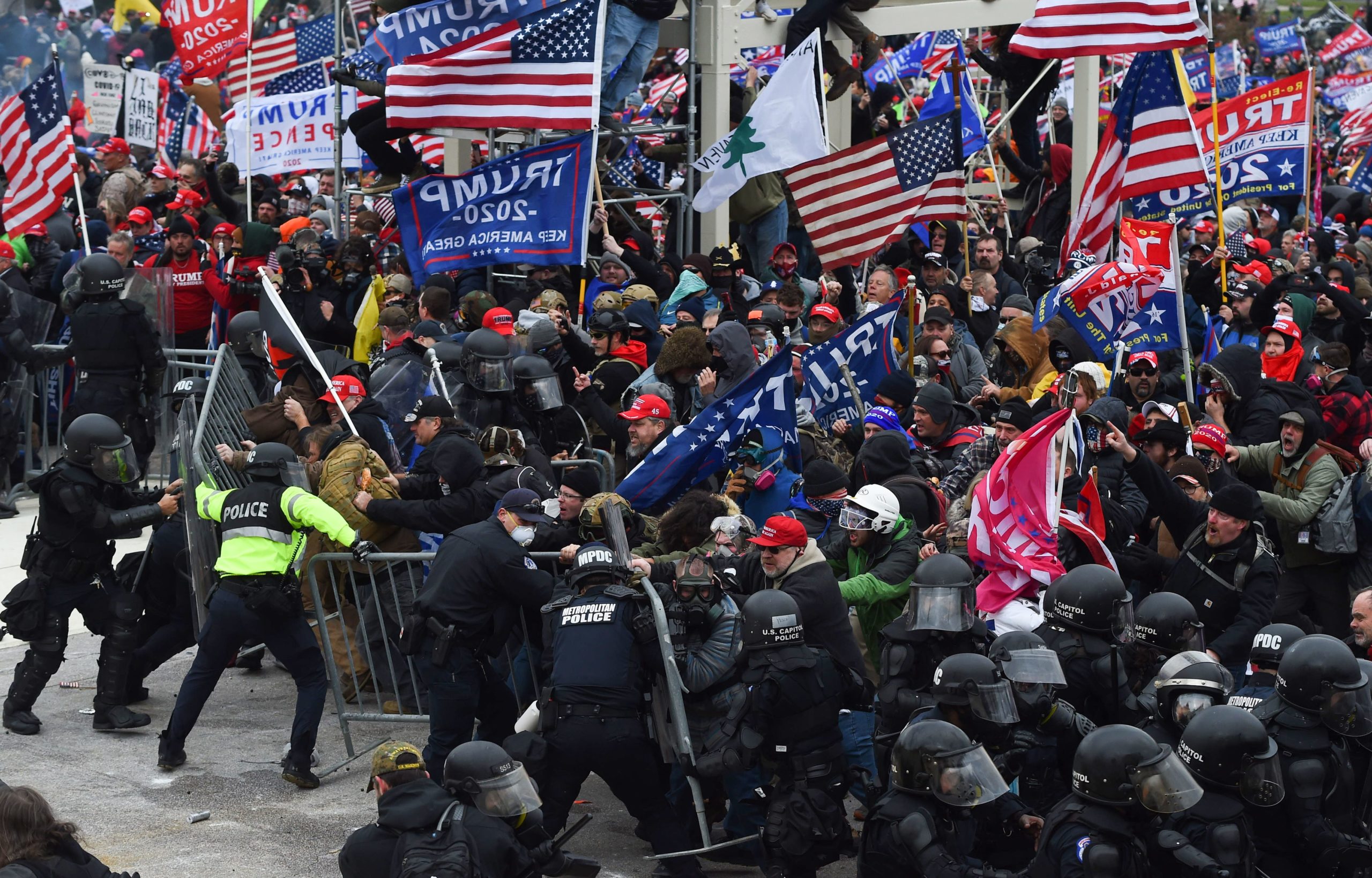 Trump supporters clash with police and security forces as they push barricades in front of the U.S. Capitol on Jan. 6. (Roberto Schmidt/AFP via Getty Images)