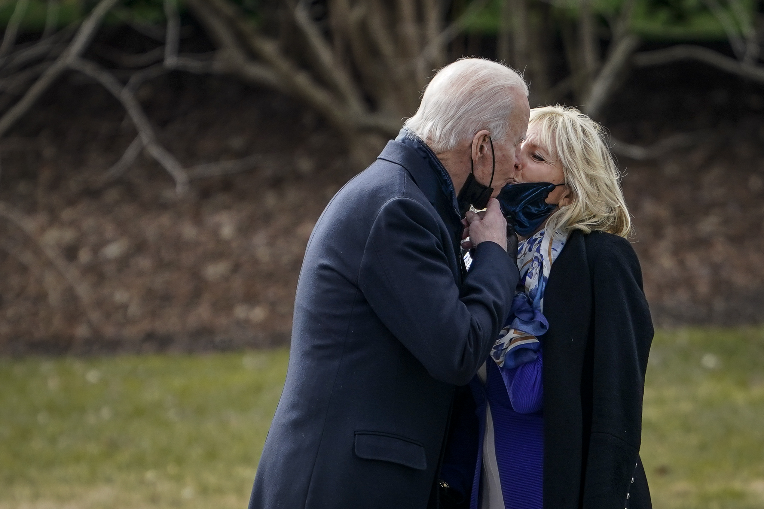 WASHINGTON, DC - JANUARY 29: U.S. President Joe Biden kisses his wife first lady Dr. Jill Biden as he walks to Marine One on the South Lawn of the White House on January 29, 2021 in Washington, DC. President Biden is traveling to Walter Reed National Military Medical Center to visit with wounded service members. (Photo by Drew Angerer/Getty Images)