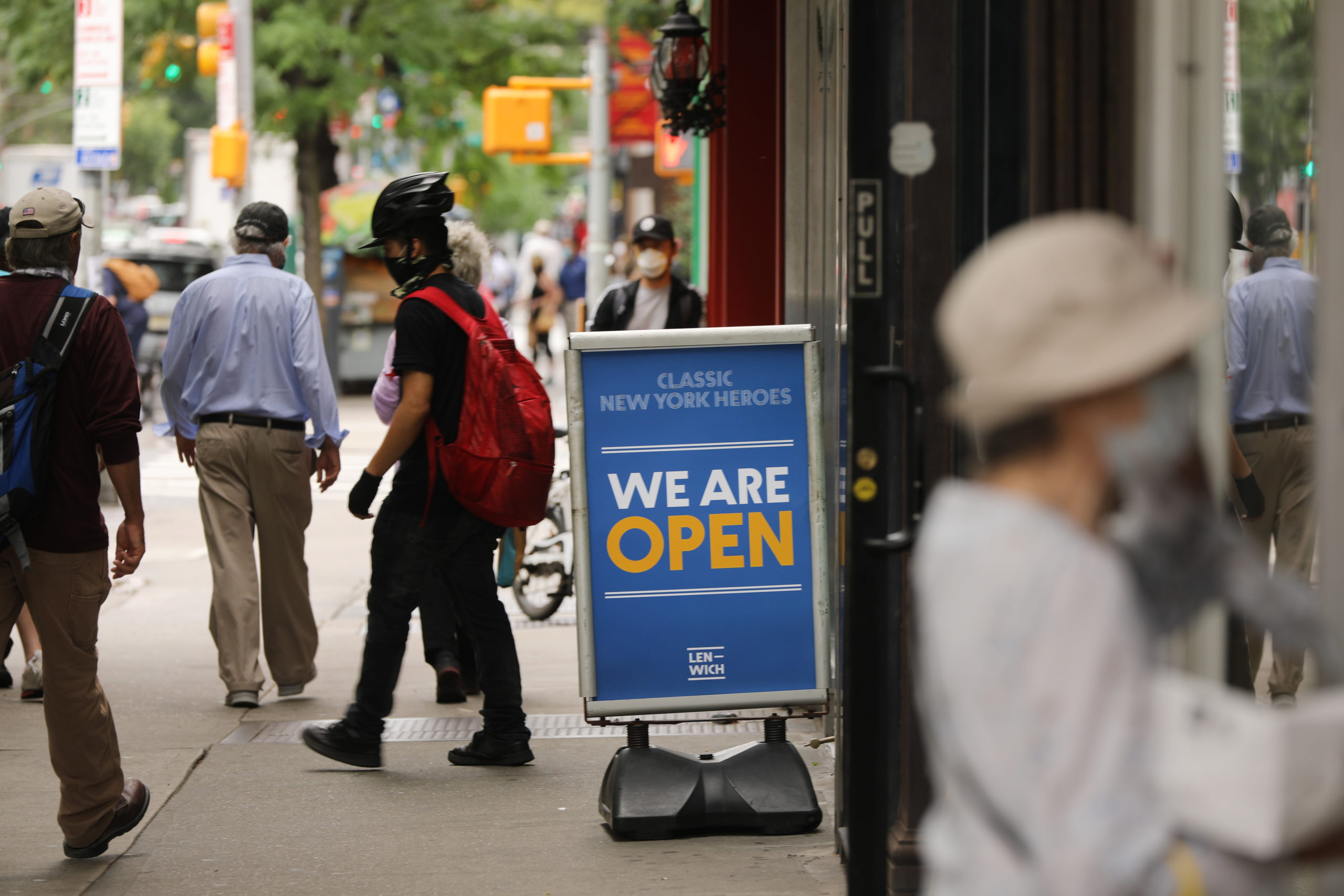 People walk through Manhattan during the summer as the city prepared to enter an additional reopening stage. (Spencer Platt/Getty Images)
