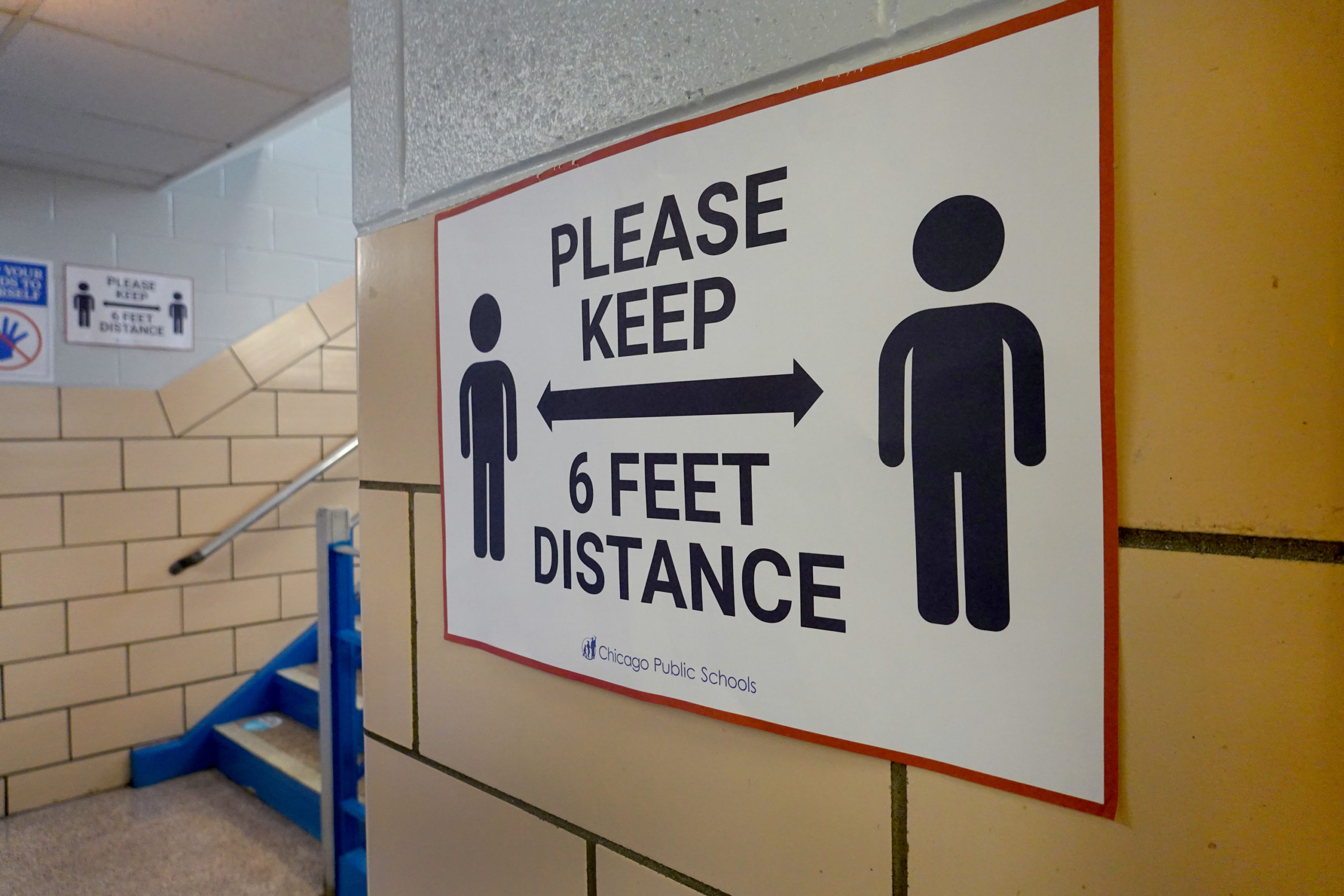 A sign in a hallway at King Elementary School in Chicago encourages social distancing as the school works to maintain a safe environment during the coronavirus pandemic. (Scott Olson/Getty Images)