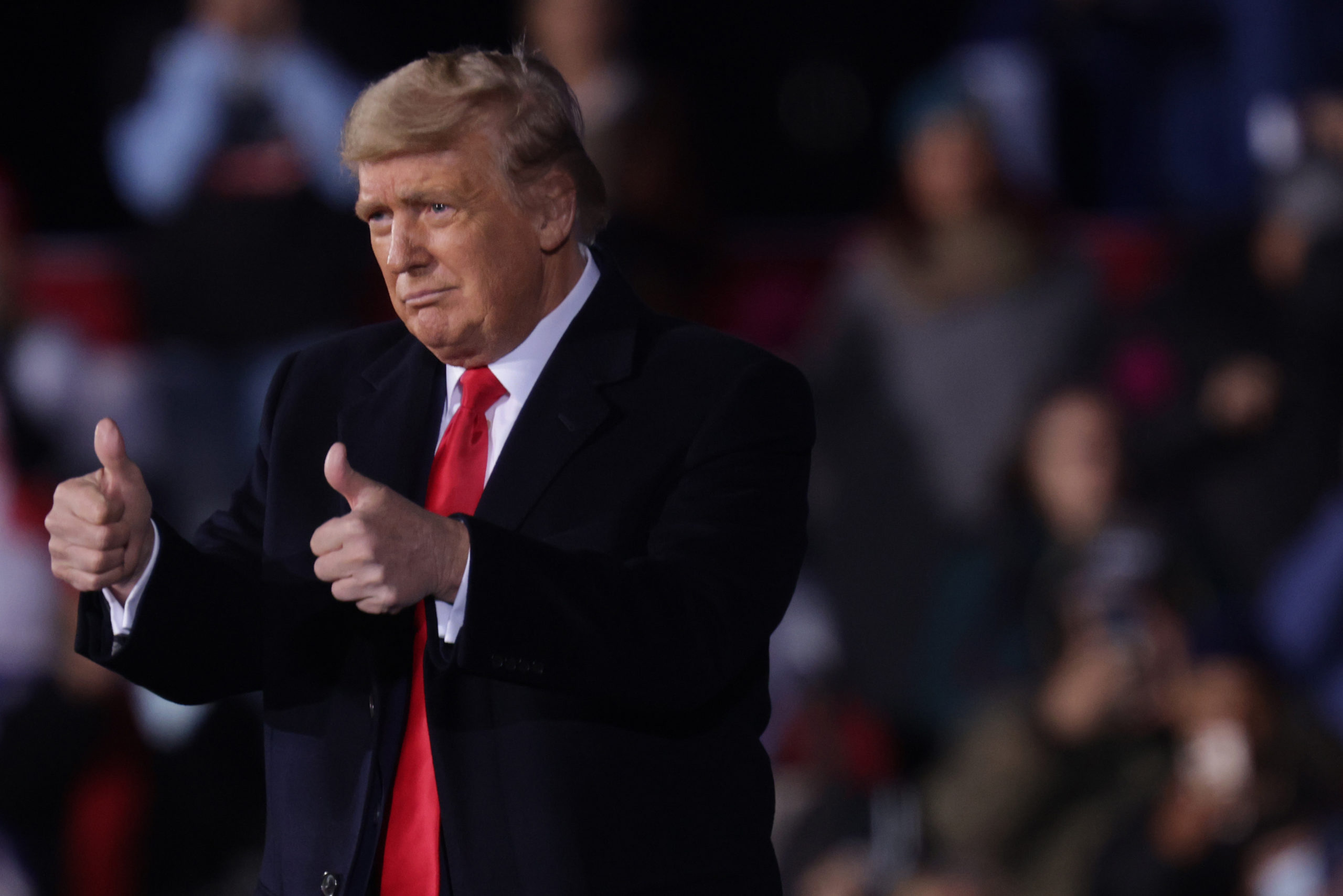 DALTON, GEORGIA - JANUARY 04: U.S. President Donald Trump holds two thumbs up during a Republican National Committee Victory Rally at Dalton Regional Airport January 4, 2021 in Dalton, Georgia. President Trump campaigned for the two incumbents, Sen. David Perdue (R-GA) and Sen. Kelly Loeffler (R-GA), for tomorrow’s runoff elections in Georgia. (Photo by Alex Wong/Getty Images)