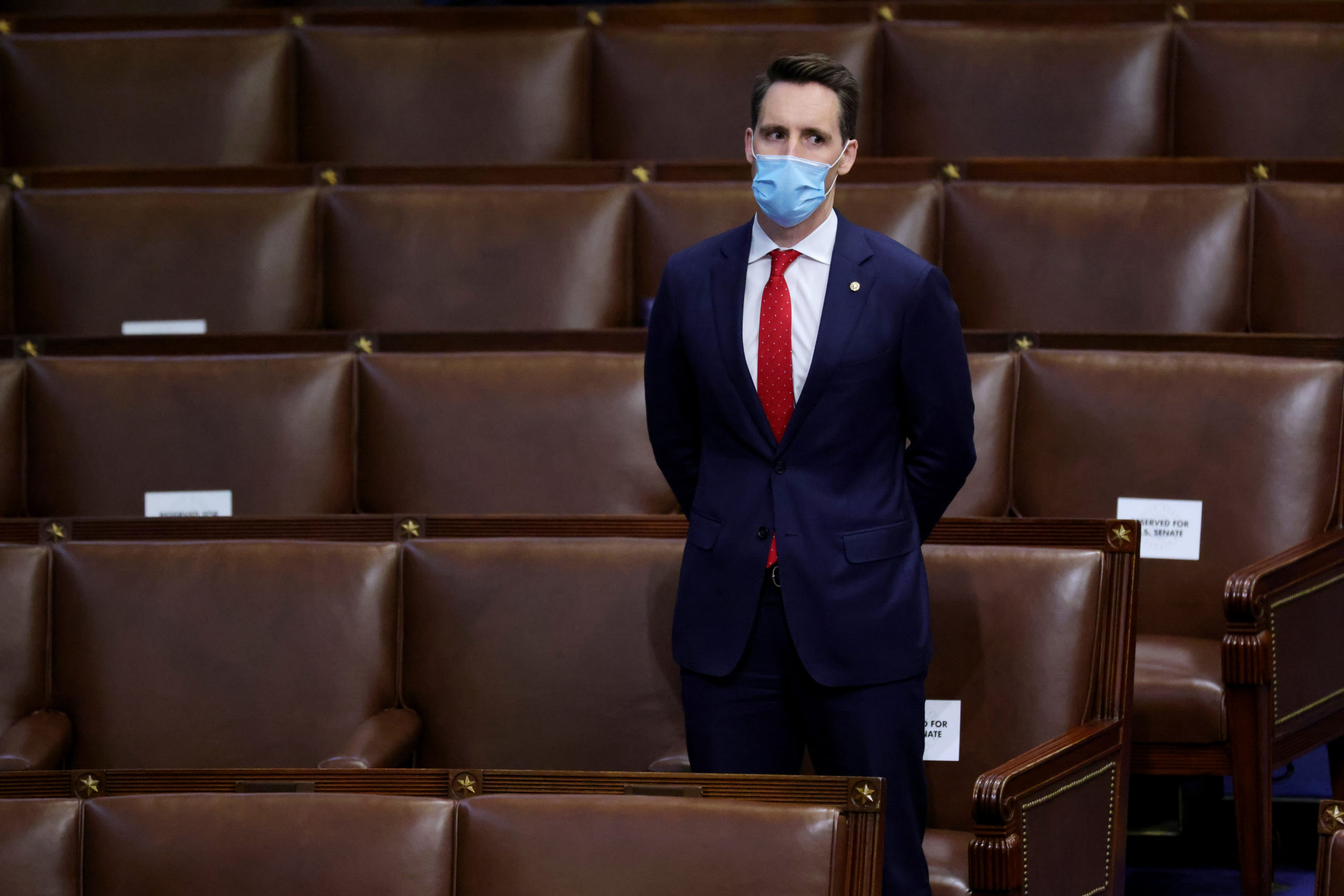 Sen. Josh Hawley stands in the House Chamber during a reconvening of a joint session of Congress on Jan. 6. (Win McNamee/Getty Images)