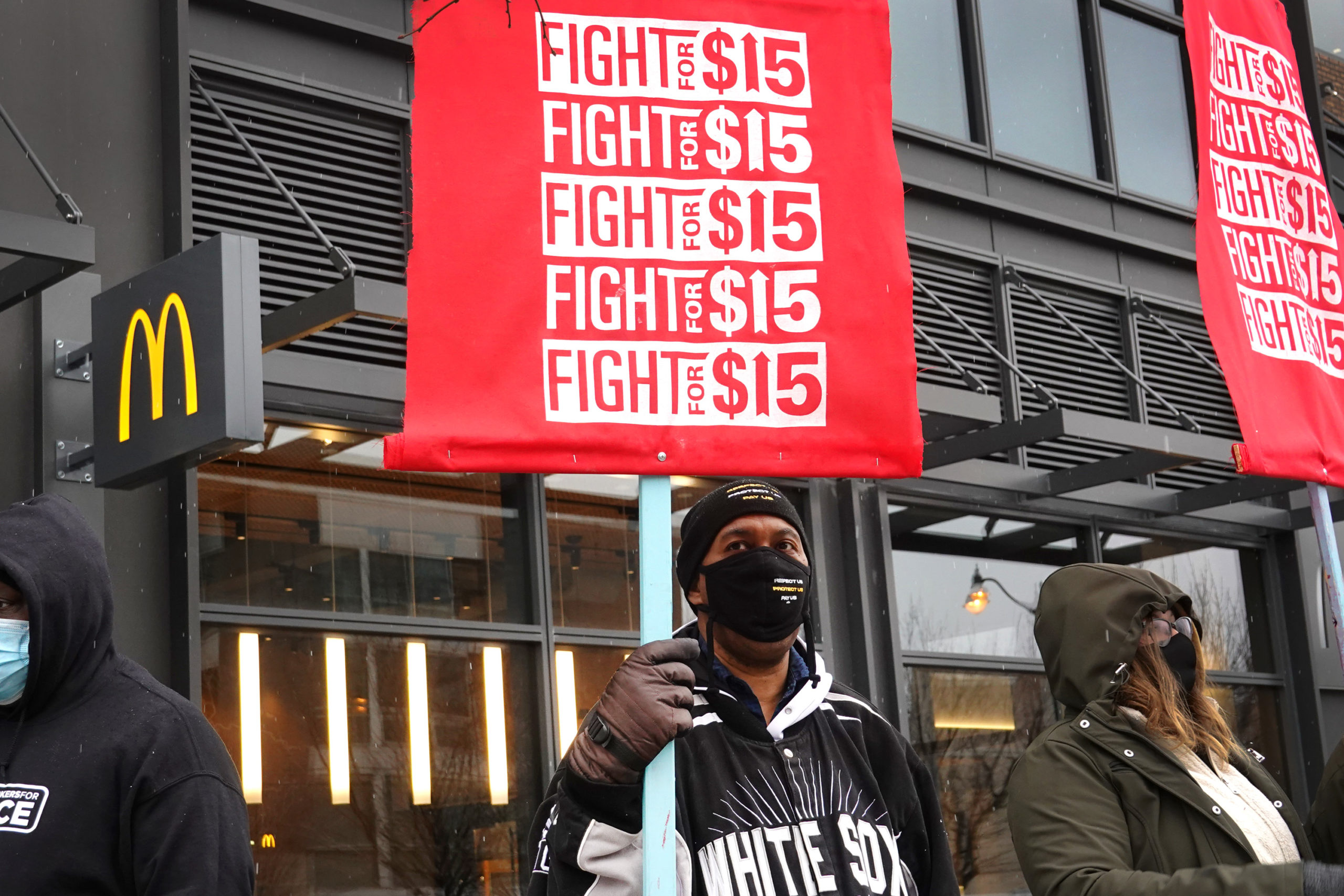 CHICAGO, ILLINOIS - JANUARY 15: Demonstrators participate in a protest outside of McDonald's corporate headquarters on January 15, 2021 in Chicago, Illinois. The protest was part of a nationwide effort calling for minimum wage to be raised to $15-per-hour. (Photo by Scott Olson/Getty Images)