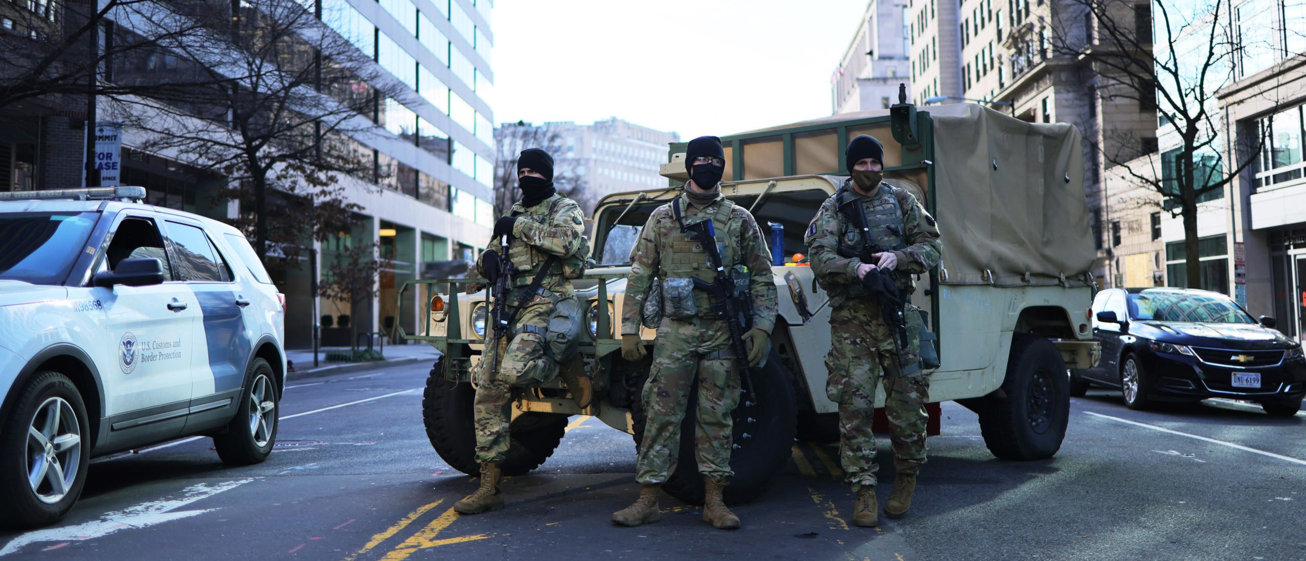 WASHINGTON, DC - JANUARY 18: National Guardsmen stand guard on 15th Street NW on January 18, 2021 in Washington, DC. After last week's riots at the U.S. Capitol Building, the FBI has warned of additional threats in the nation's capital and in all 50 states. According to reports, as many as 25,000 National Guard soldiers will be guarding the city as preparations are made for the inauguration of Joe Biden as the 46th U.S. President. (Photo by Michael M. Santiago/Getty Images)