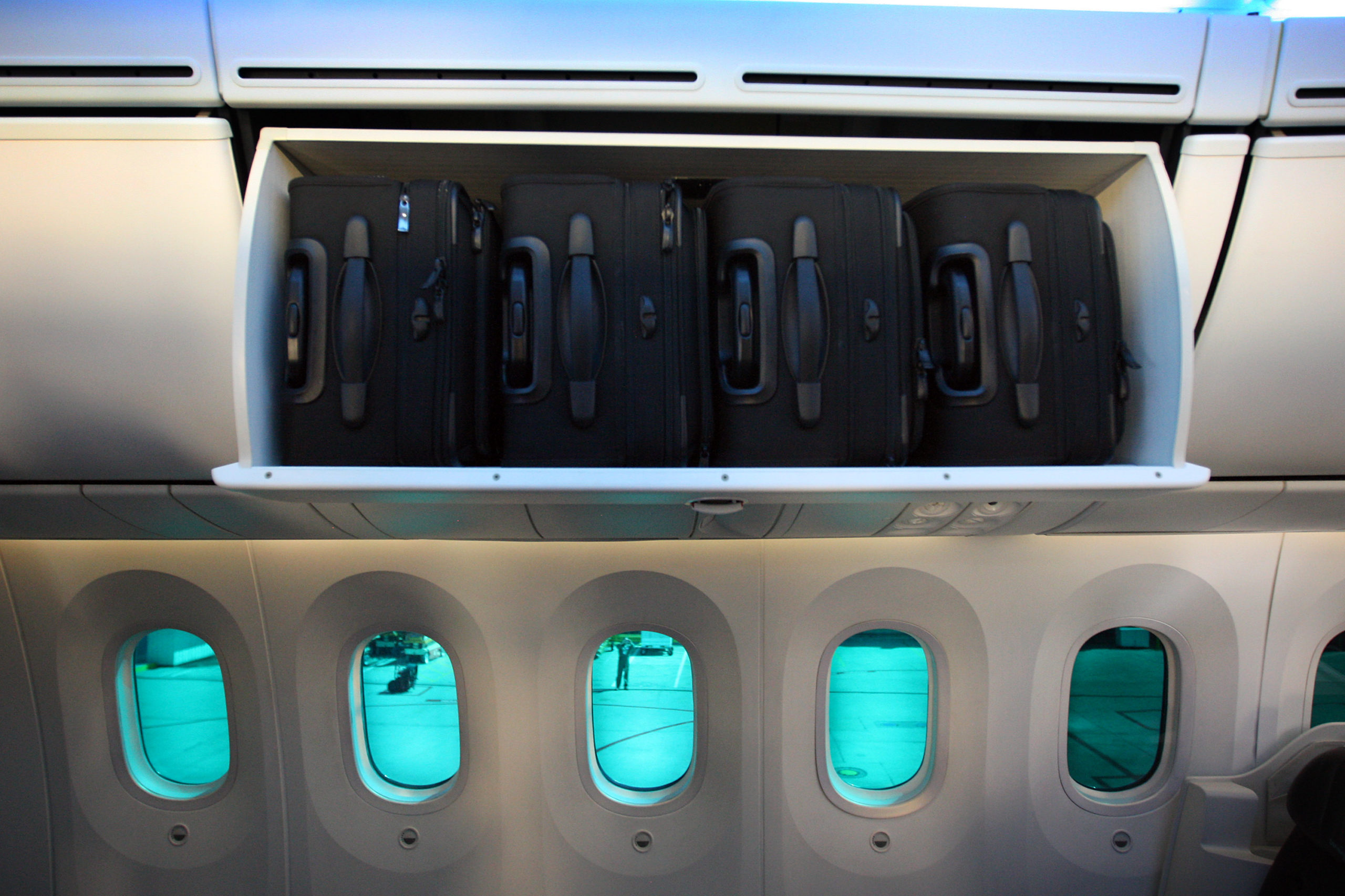 LONG BEACH, CA - MARCH 14: Windows that can darken with the press of a button and luggage in an overhead compartment are seen aboard the new Boeing 787 Dreamliner passenger jet on March 14, 2012 in Long Beach, California. Boeing employs more than 20,000 people in California. making it one of the largest private employers in the state. (Photo by David McNew/Getty Images)