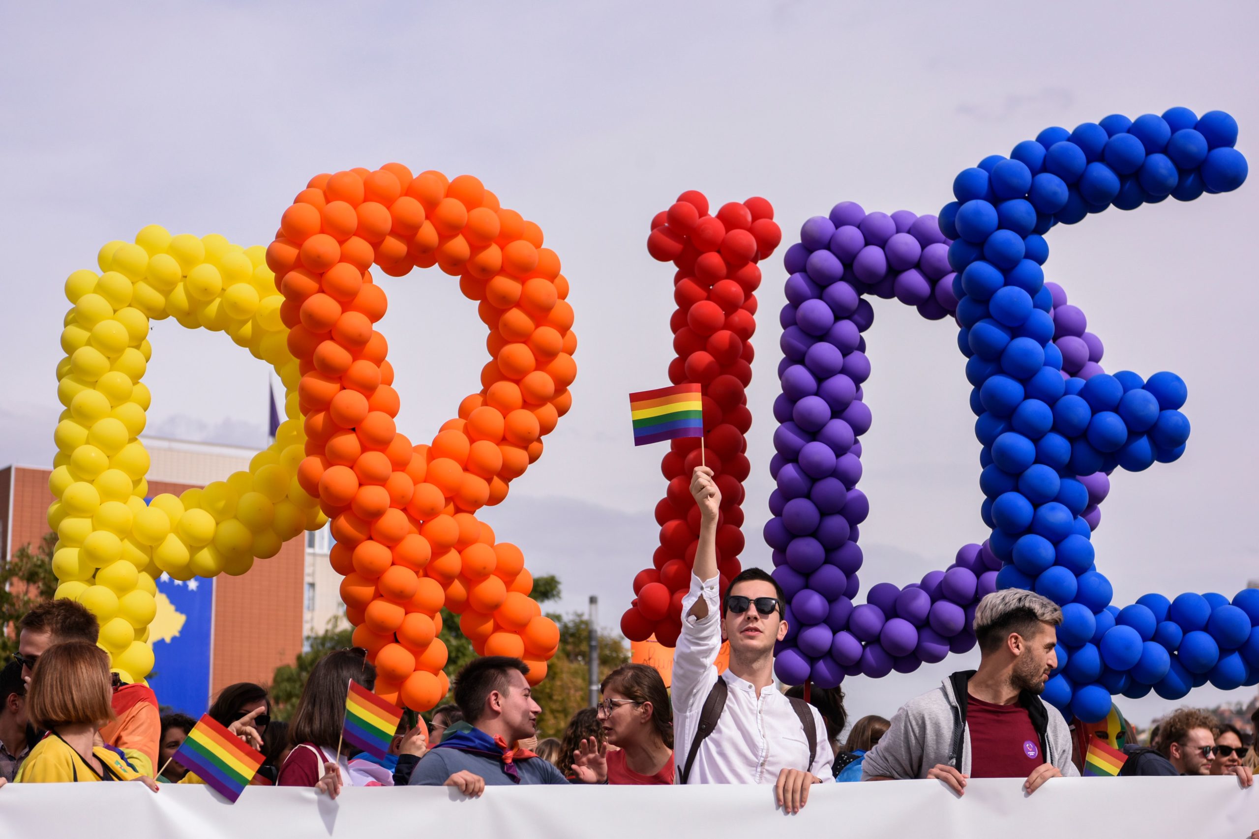 People hold balloons forming the word "Pride" during the Gay Pride parade in Pristina on October 10, 2019. - Hundreds of Kosovo people marched along the main street during a Gay parade demanding "freedom" and "equal rights" in the patriarchal and Muslim majority country with little tolerant views on sexuality. (Photo by Armend Nimani/AFP via Getty Images)