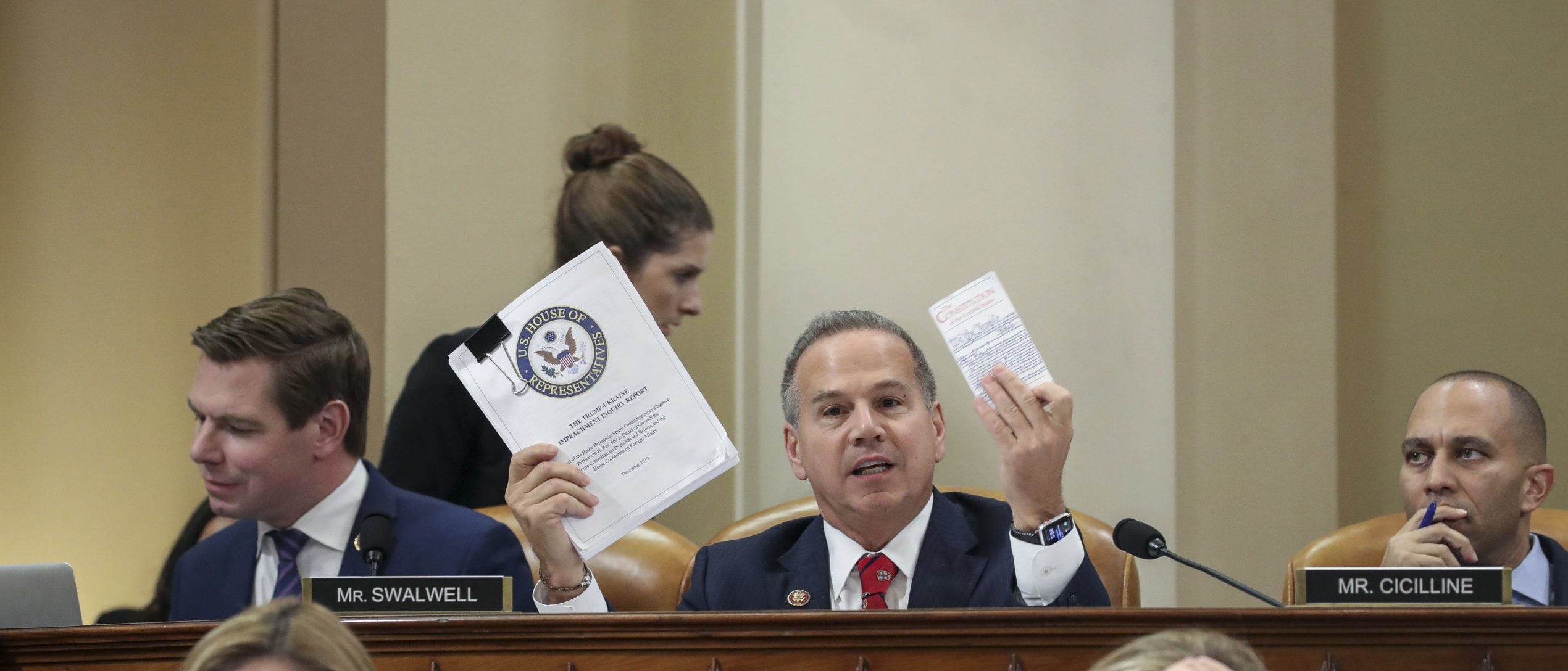 WASHINGTON, DC - DECEMBER 12:U.S. Rep. David Cicilline (D-RI) holds up a copy of the House Intelligence Committee's report on the impeachment inquiry and a copy of the U.S. Constitution during a House Judiciary Committee markup hearing on the articles of impeachment against U.S. President Donald Trump in the Longworth House Office Building on Capitol Hill December 12, 2019 in Washington, DC. The articles of impeachment charge Trump with abuse of power and obstruction of Congress. House Democrats claim that Trump posed a 'clear and present danger' to national security and the 2020 election in his dealings with Ukraine over the past year. (Photo by Drew Angerer/Getty Images)
