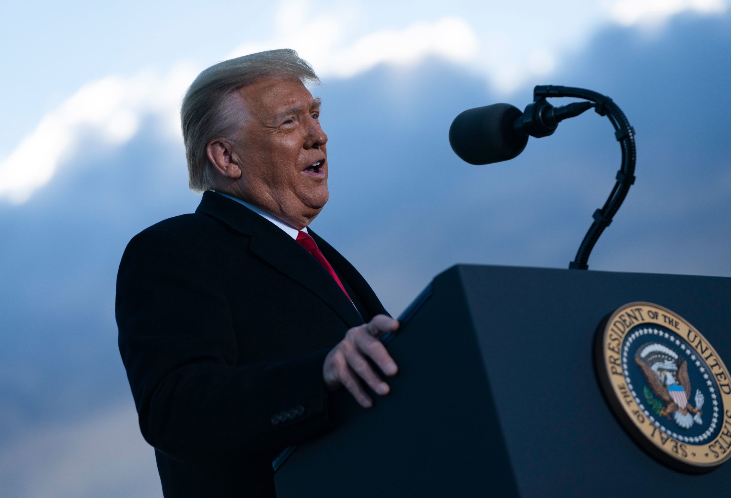 Outgoing US President Donald Trump addresses guests at Joint Base Andrews in Maryland on January 20, 2021. - President Trump and the First Lady travel to their Mar-a-Lago golf club residence in Palm Beach, Florida, and will not attend the inauguration for President-elect Joe Biden. (Photo by ALEX EDELMAN/AFP via Getty Images)