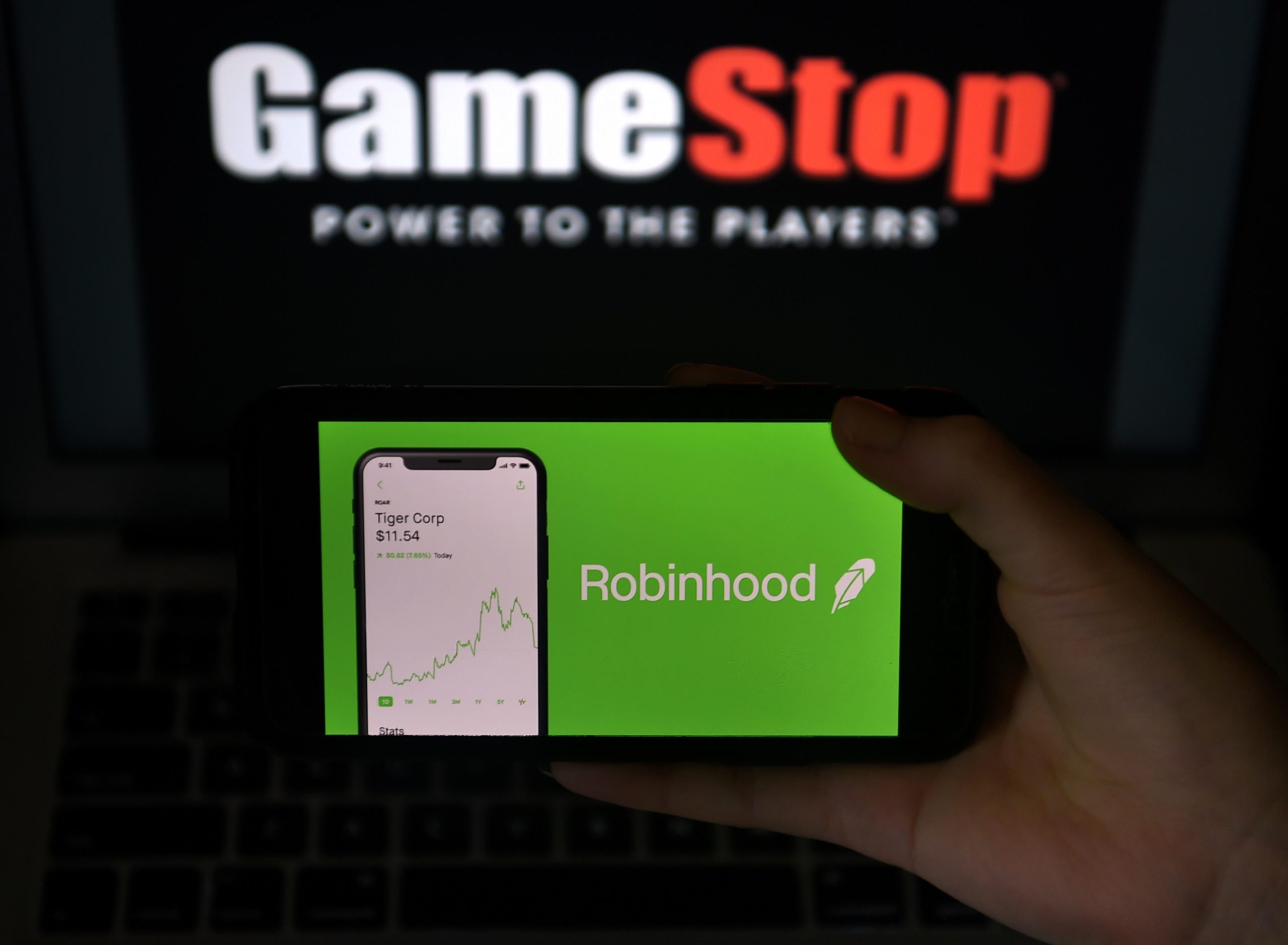 An illustration of GameStop and Robinhood logos are pictured in Arlington, Virginia on Jan. 28. (Olivier Douliery/AFP via Getty Images)