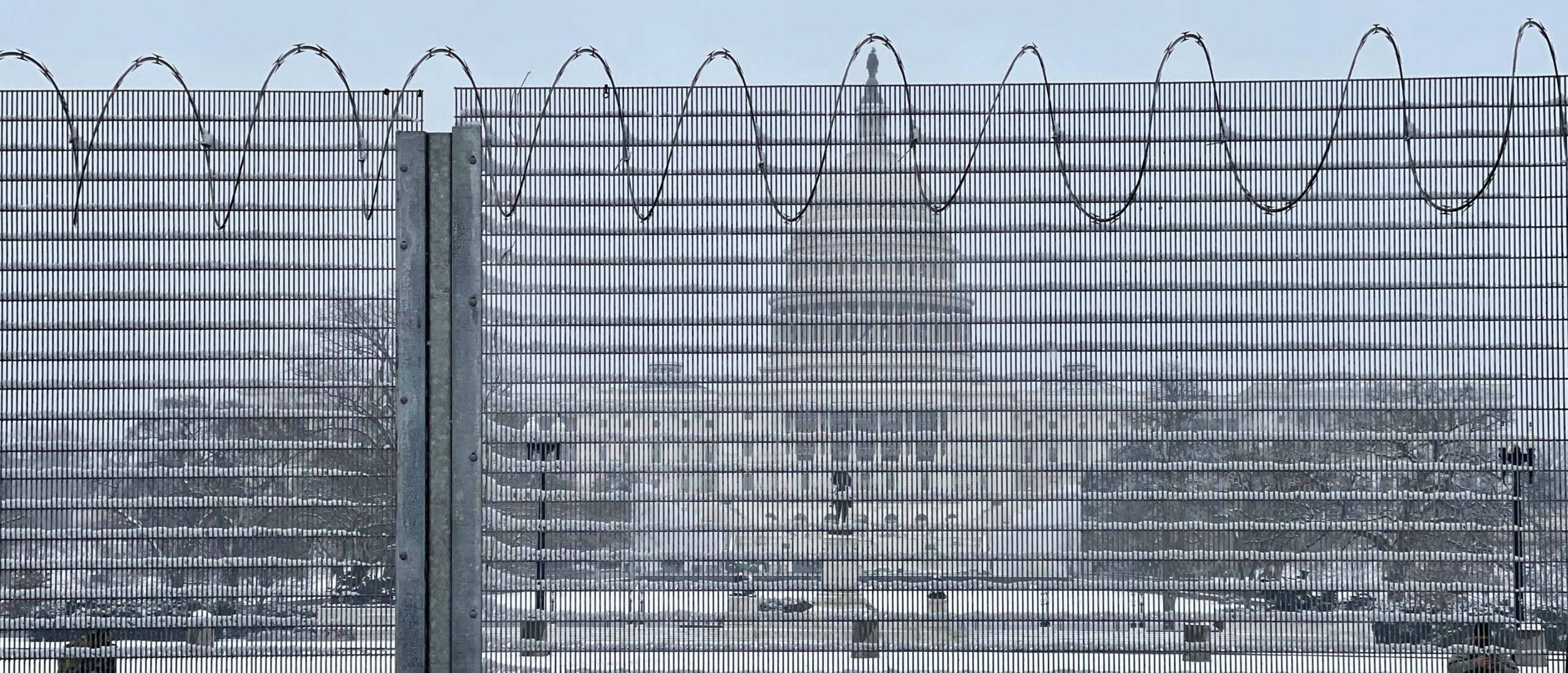 Fencing is seen in front of the US Capitol on January 31, 2021 after a snowfall in Washington, DC. (Photo by Daniel SLIM / AFP) (Photo by DANIEL SLIM/AFP via Getty Images)
