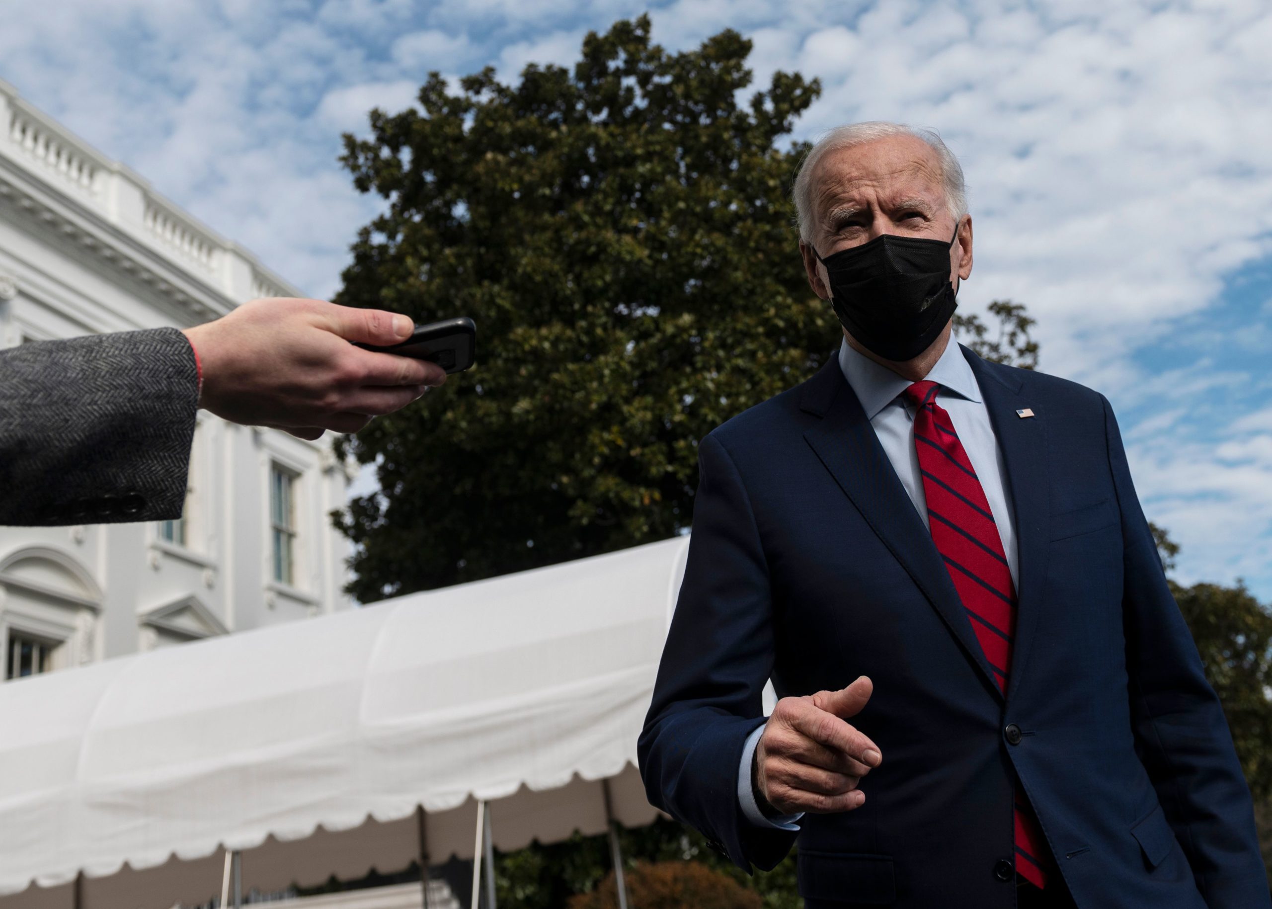 US President Joe Biden speaks to reporters as he departs for Wilmington, Delaware, from the South Lawn of the White House in Washington, DC, on February 27, 2021. (Photo by ANDREW CABALLERO-REYNOLDS/AFP via Getty Images)