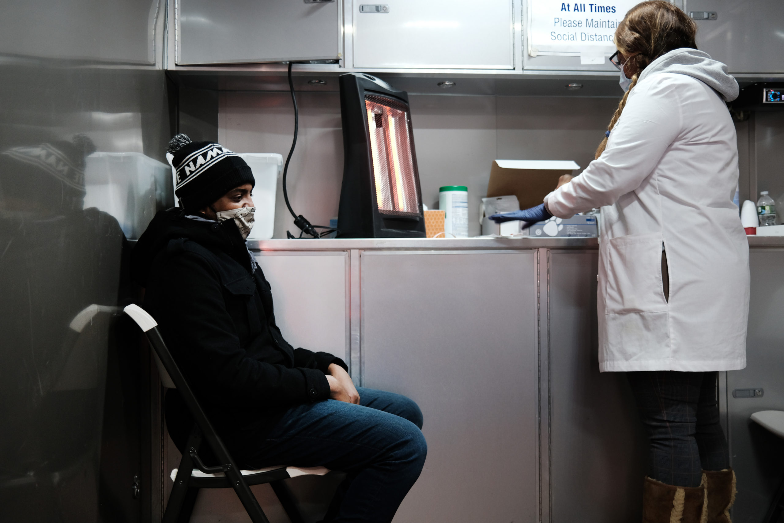 NEW YORK, NEW YORK - JANUARY 27: Jackie, a nurse, prepares a Covid-19 test at a mobile clinic in Brooklyn on January 27, 2021 in New York City. With the overall infection rate across the state on the decline and 72% of healthcare workers now having received the COVID-19 vaccine, Governor Andrew Cuomo has announced that some restrictions in New York may be lifted in the near future. According to the Governor this will not include indoor dining. (Photo by Spencer Platt/Getty Images)