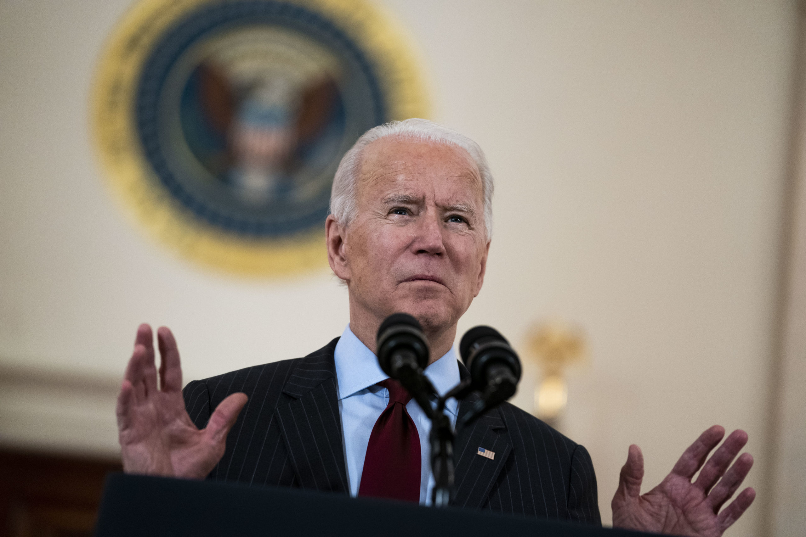 WASHINGTON, DC - FEBRUARY 22: U.S. President Joe Biden delivers remarks on the more than 500,000 lives lost to COVID-19 in the Cross Hall of the White House February 22, 2021 in Washington, DC. Also on hand for the ceremony were first lady Jill Biden, Vice President Kamala Harris and husband Doug Emhoff. (Photo by Doug Mills-Pool/Getty Images)