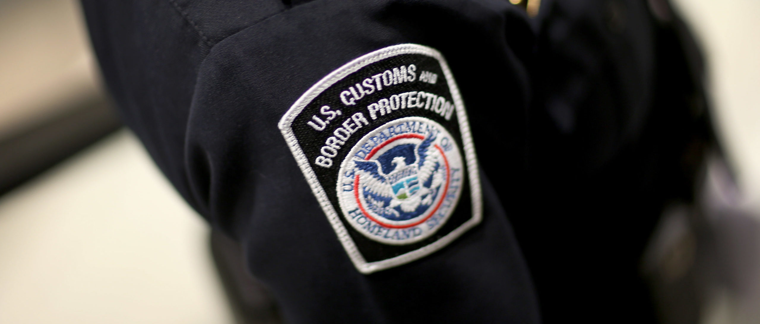 MIAMI, FL - MARCH 04: A U.S. Customs and Border Protection officer's patch is seen as they unveil a new mobile app for international travelers arriving at Miami International Airport on March 4, 2015 in Miami, Florida. (Photo by Joe Raedle/Getty Images)