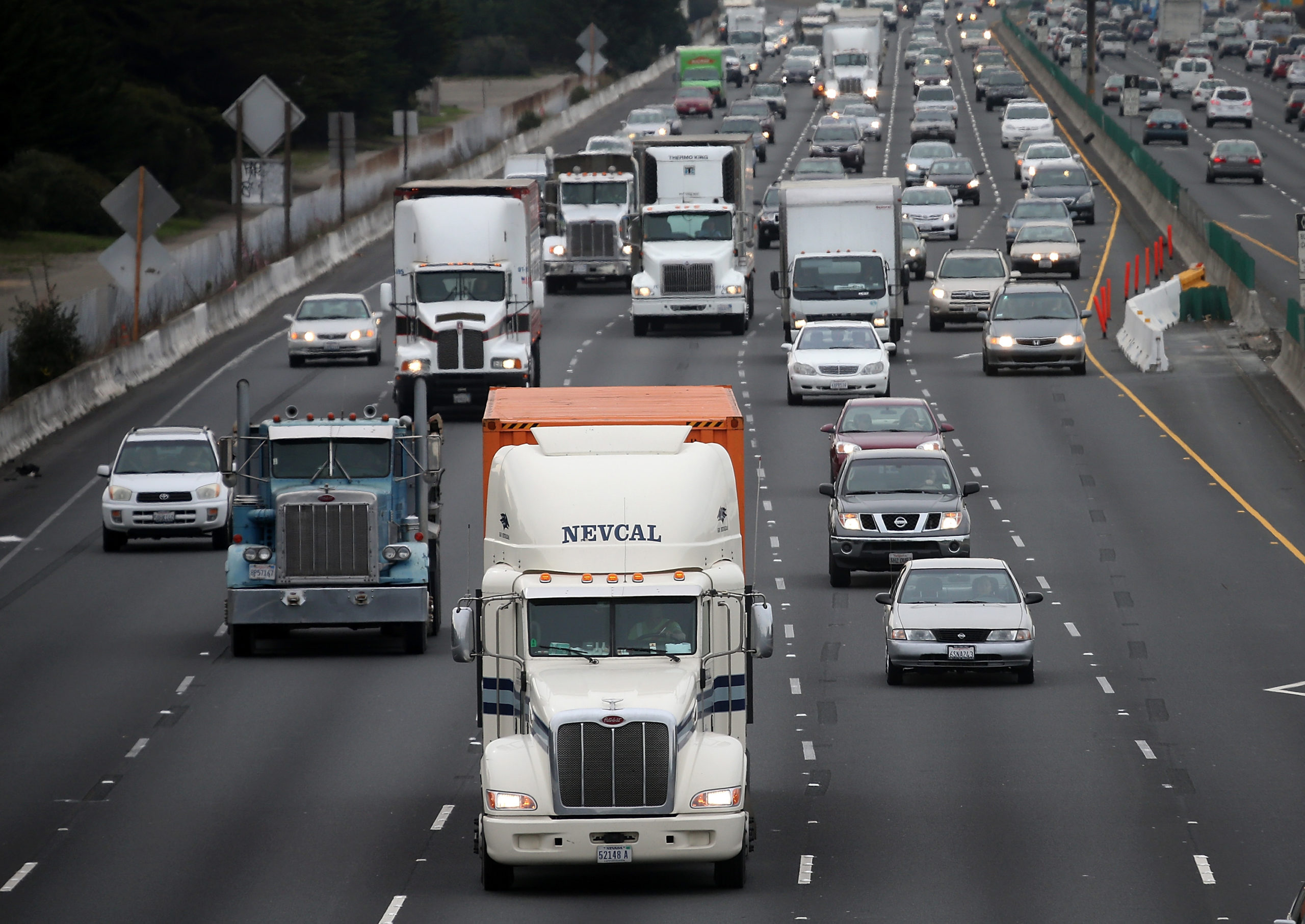 BERKELEY, CA - FEBRUARY 18: Trucks drive along Interstate 80 on February 18, 2014 in Berkeley, California. (Photo by Justin Sullivan/Getty Images)