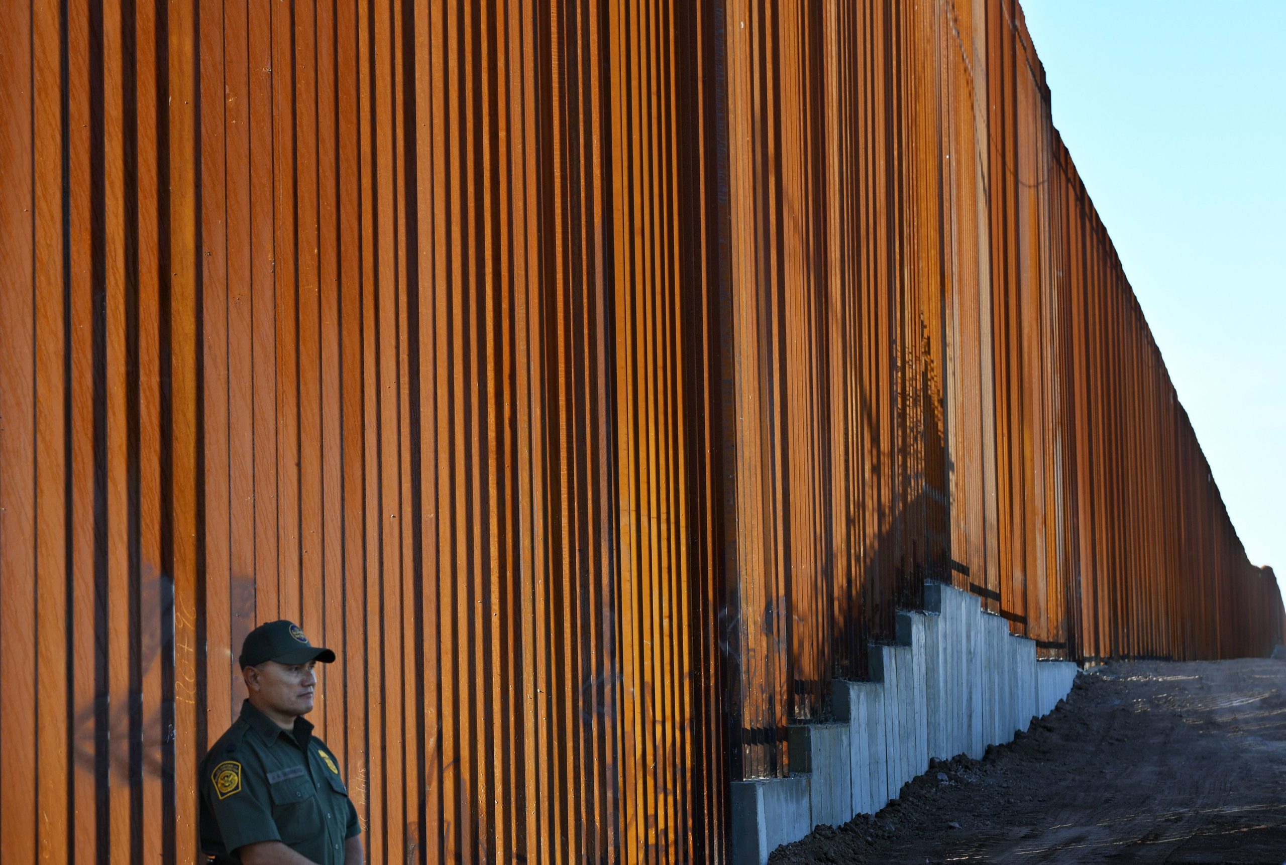 TOPSHOT - Border Patrol officers keep warch before U.S. Department of Homeland Security Secretary Kirstjen M. Nielsen inaugurates the first completed section of President Trumps 30-foot border wall in the El Centro Sector, at the US Mexico border in Calexico, California on October 26, 2018. (Photo by Mark RALSTON / AFP) (Photo credit should read MARK RALSTON/AFP via Getty Images)