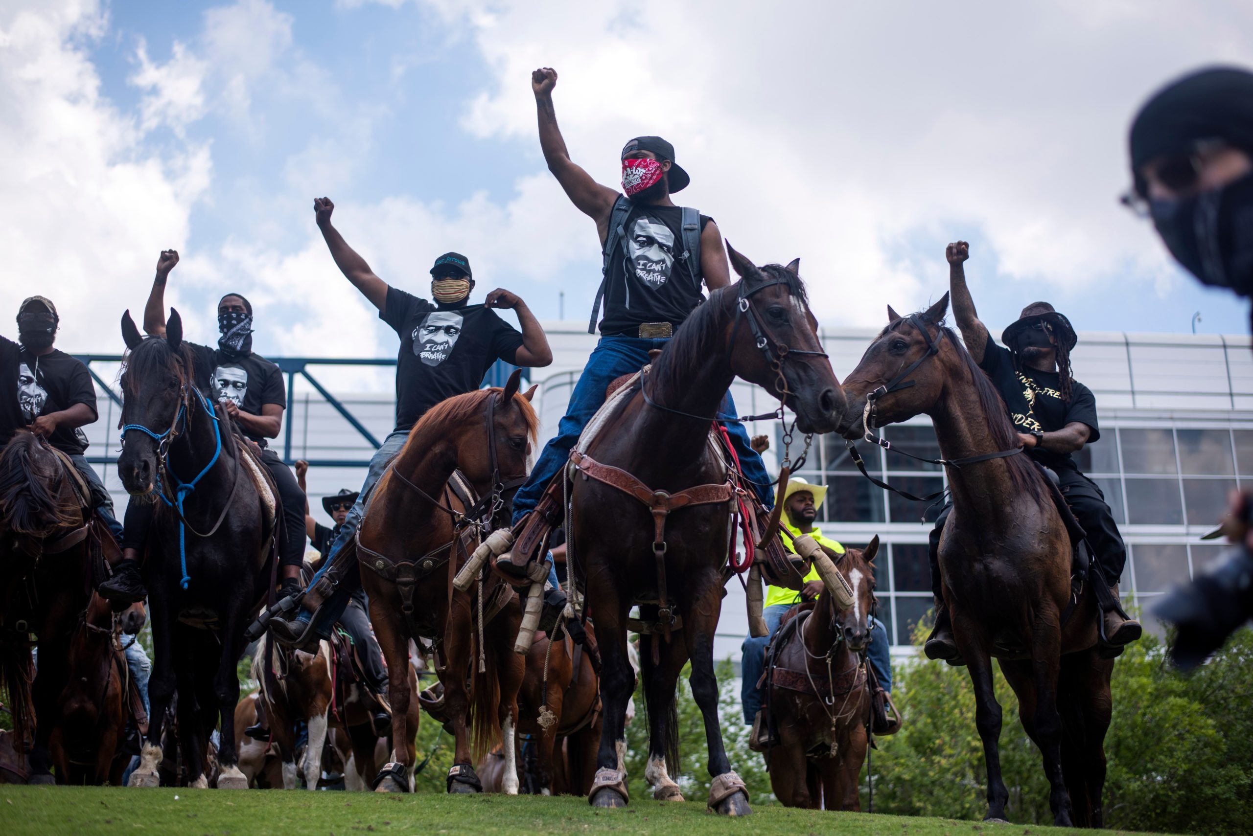 TOPSHOT - Protesters demonstrate to mourn the death of George Floyd during a march across downtown Houston, Texas, on June 2, 2020. - Anti-racism protests have put several US cities under curfew to suppress rioting, following the death of George Floyd while in police custody. (Photo by Mark Felix / AFP) (Photo by MARK FELIX/AFP via Getty Images)