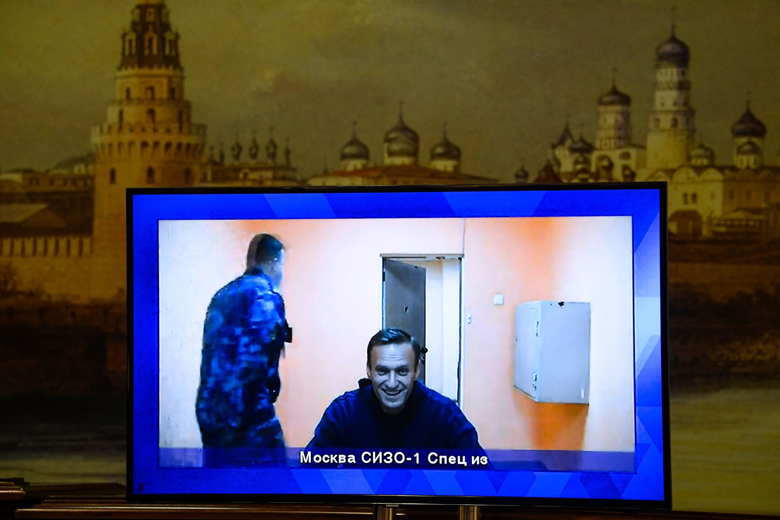 Opposition leader Alexei Navalny appears on a screen set up at a hall of the Moscow Regional Court via a video link from Moscow's penal detention centre Number 1 (known as Matrosskaya Tishina) during a court hearing of an appeal against his arrest, in Krasnogorsk outside Moscow on January 28, 2021. - Navalny, 44, was detained on January 17 upon returning to Moscow after five months in Germany recovering from a near-fatal poisoning with a nerve agent and later jailed for 30 days while awaiting trial for violating a suspended sentence he was handed in 2014. (Photo by Alexander NEMENOV / AFP) (Photo by ALEXANDER NEMENOV/AFP via Getty Images)