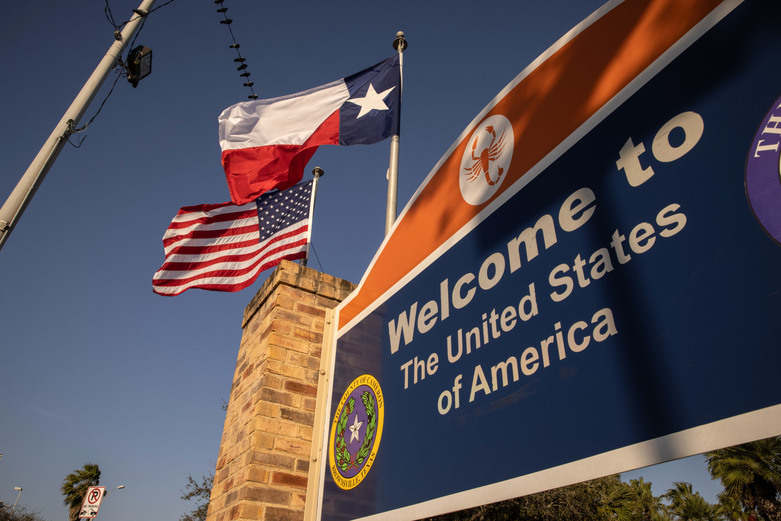 BROWNSVILLE, TEXAS - FEBRUARY 24: The U.S. and Texas flags fly near the U.S.-Mexico border on February 24, 2021 in Brownsville, Texas. (Photo by John Moore/Getty Images)