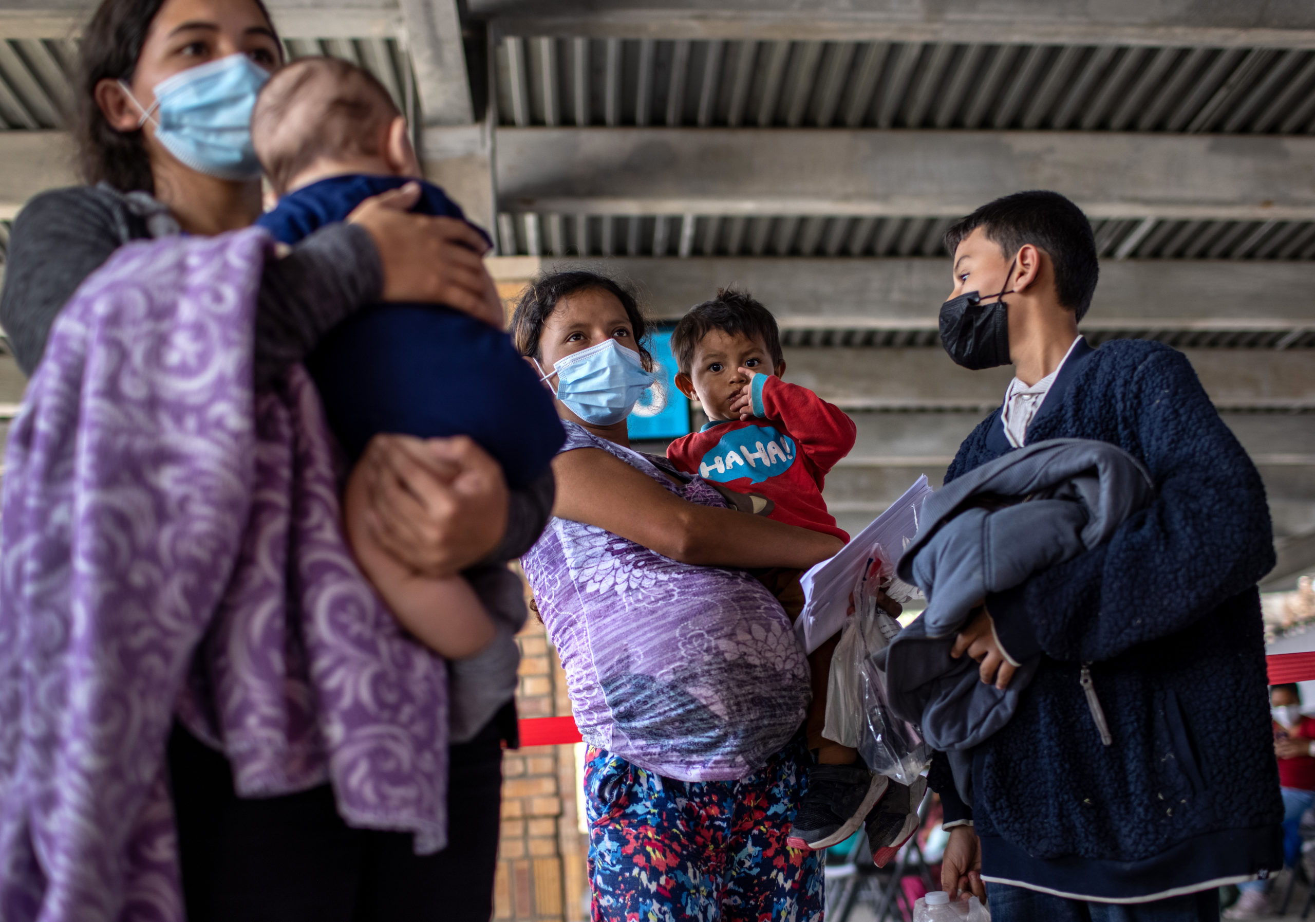 BROWNSVILLE, TEXAS - FEBRUARY 26: Central American asylum seekers arrive to a bus station after being released by U.S. Border Patrol agents on February 26, 2021 in Brownsville, Texas. U.S. immigration authorities are now releasing many asylum seeking families after they cross the U.S.-Mexico border and are taken into custody. The immigrant families are then free to travel to destinations throughout the U.S. while awaiting asylum hearings. (Photo by John Moore/Getty Images)