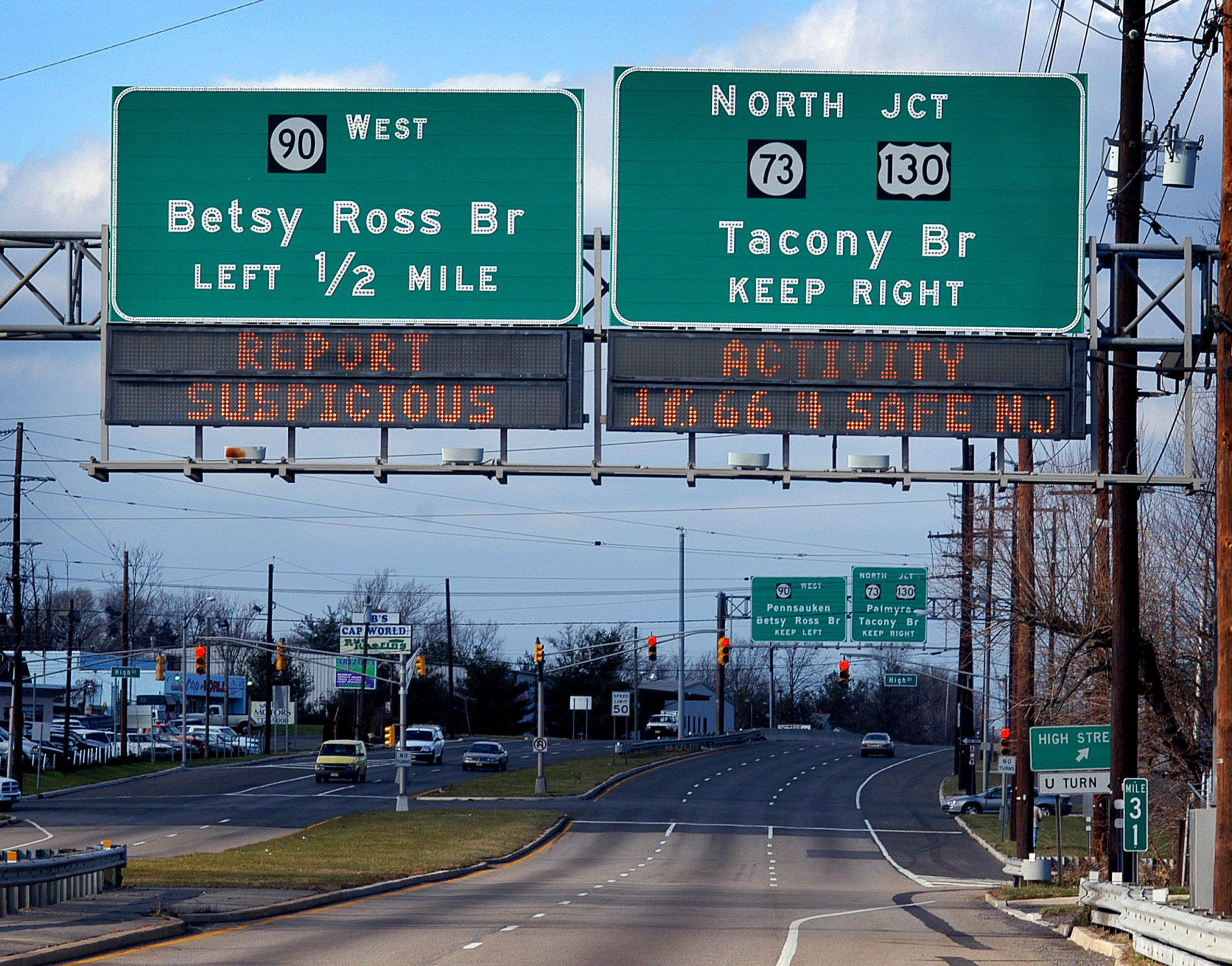 MAPLE SHADE, NJ - DECEMBER 30: A highway sign advises drivers to report suspicous activity, December 30, 2003 in Maple Shade, New Jersey. U.S. authorities intensified security procedures around the country after officials raised the terror alert to Orange, the second highest level in advance of the year-end holiday period. (Photo by William Thomas Cain/Getty Images)