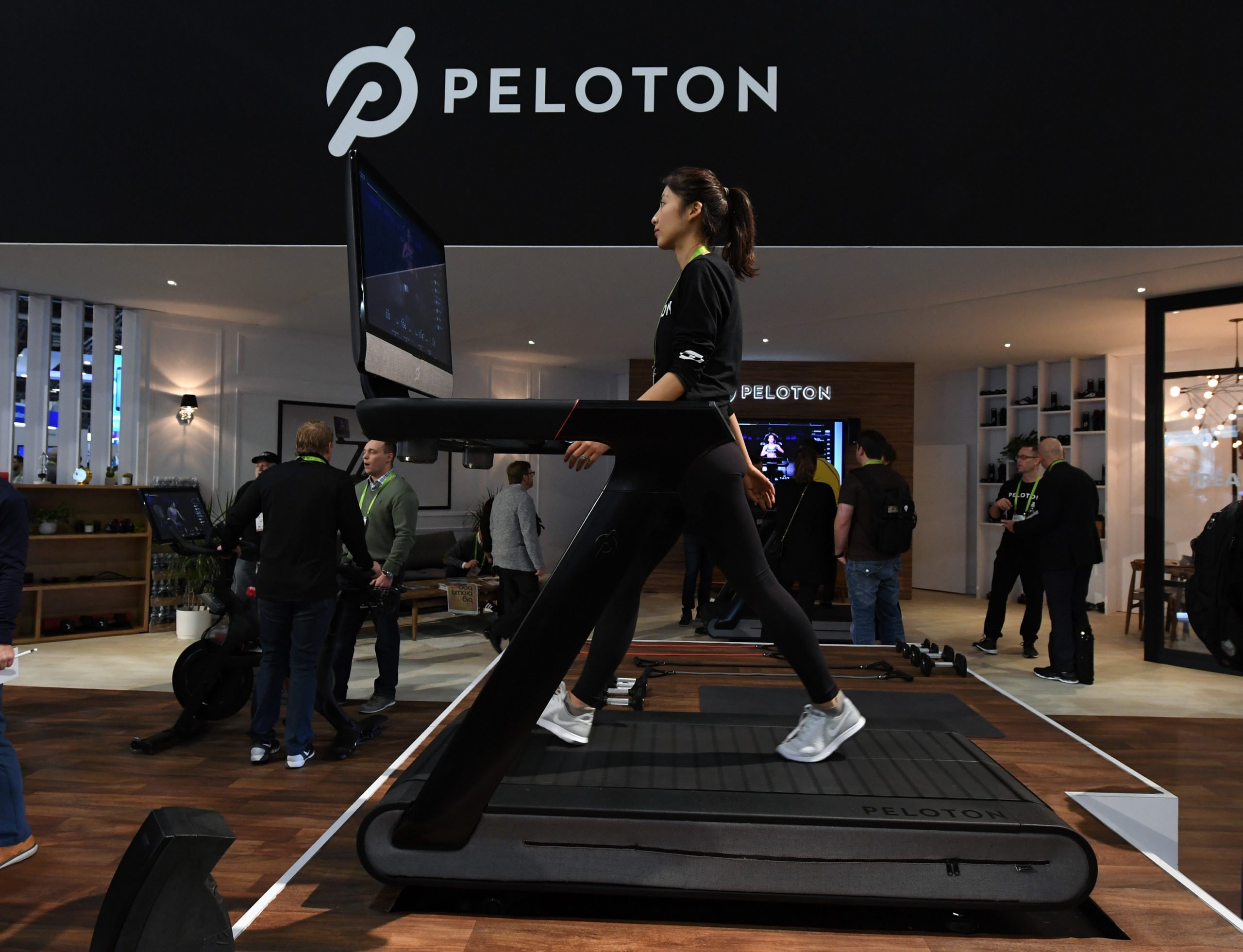 LAS VEGAS, NV - JANUARY 11: Maggie Lu uses a Peloton Tread treadmill during CES 2018 at the Las Vegas Convention Center on January 11, 2018 in Las Vegas, Nevada. The USD 3,995 workout machine is expected to be available later this year and features a 32-inch touch screen that connects users to instructors giving live or on-demand fitness classes. CES, the world's largest annual consumer technology trade show, runs through January 12 and features about 3,900 exhibitors showing off their latest products and services to more than 170,000 attendees. (Photo by Ethan Miller/Getty Images)
