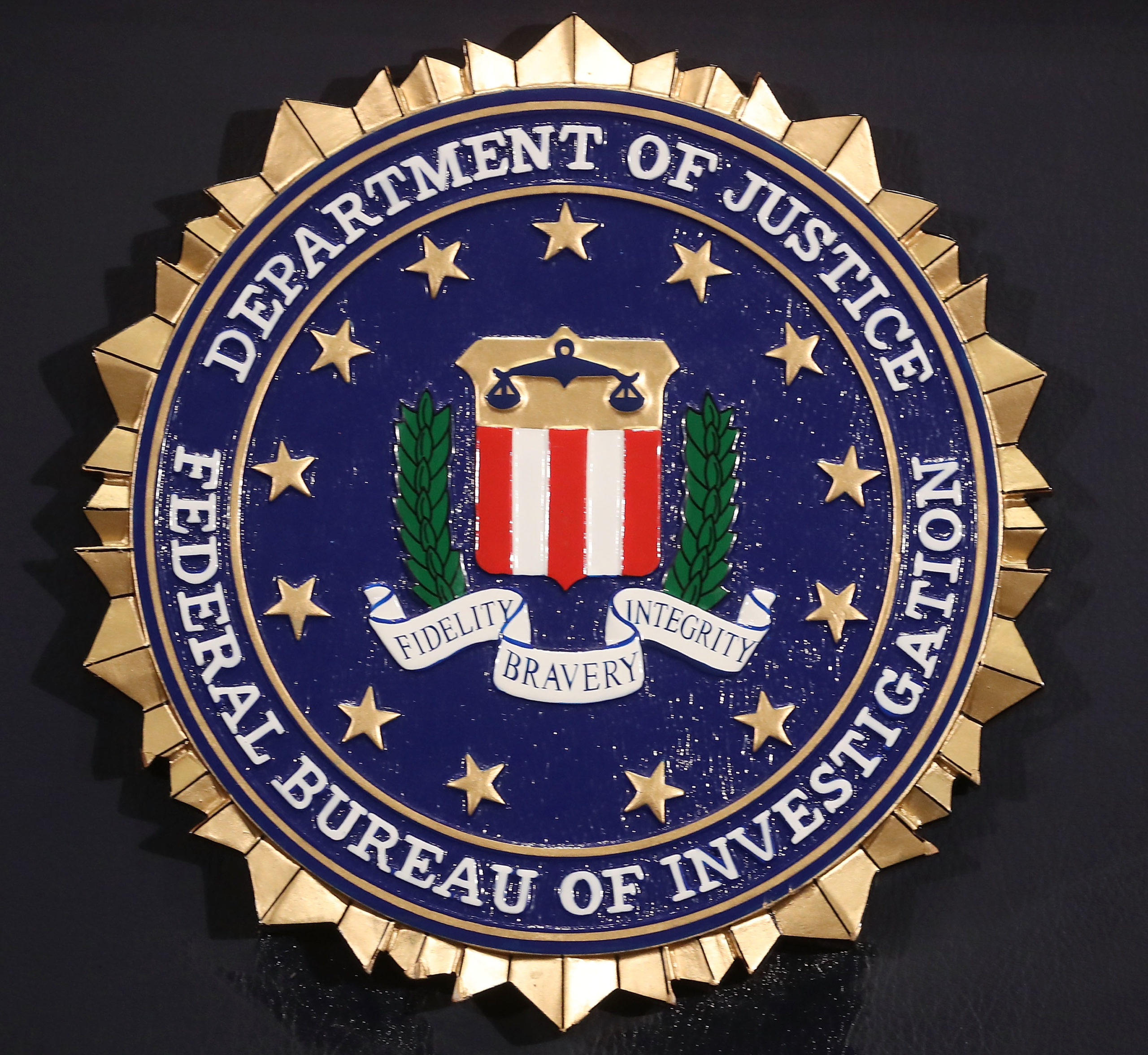 WASHINGTON, DC - JUNE 14: The FBI seal is attached to a podium prior to Director is Christopher A. Wray speakin at a news conference at FBI Headquarters, on June 14, 2018 in Washington, DC. Earlier today the inspector general released a 500 page report on the Clinton email investigation. (Photo by Mark Wilson/Getty Images)