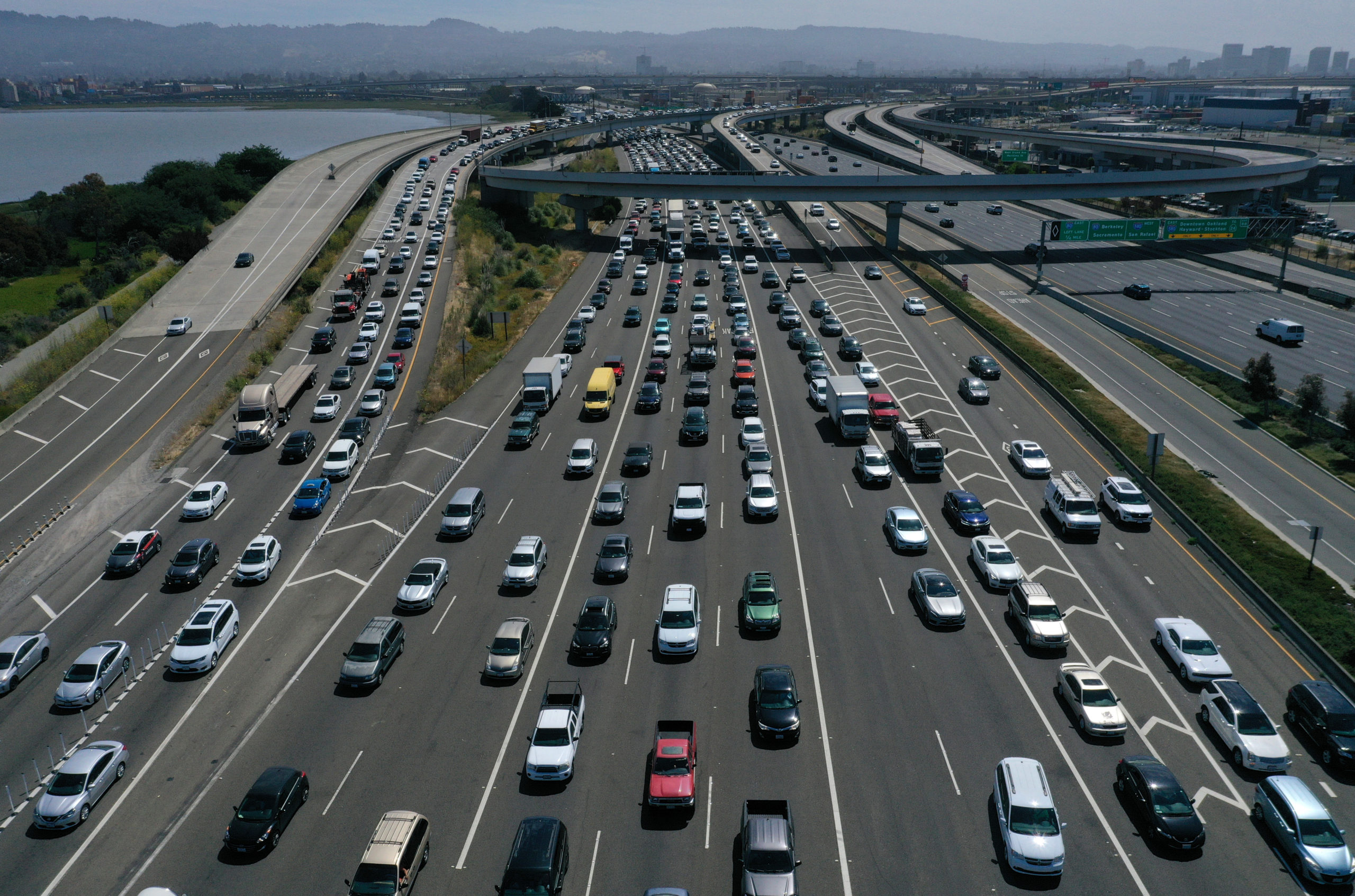 SAN RAFAEL, CALIFORNIA - JULY 25: Traffic backs up at the San Francisco-Oakland Bay Bridge toll plaza along Interstate 80 on July 25, 2019 in Oakland, California. The State of California and four of the largest automakers in the world - Ford, VW, Honda and BMW - have struck a deal to reduce auto emissions in the State of California ahead of the Trump administration's plans to eliminate an Obama-era regulation to reduce emissions from cars that are believed to contribute to global warming. (Photo by Justin Sullivan/Getty Images)