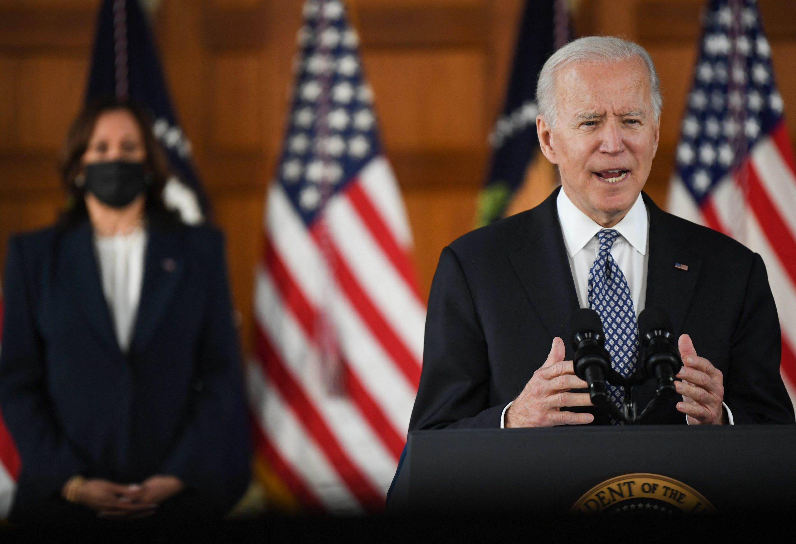 US President Joe Biden speaks as US Vice President Kamala Harris looks on during a listening session with Georgia Asian American and Pacific Islander community leaders at Emory University in Atlanta, Georgia on March 19, 2021. (ERIC BARADAT/AFP via Getty Images)