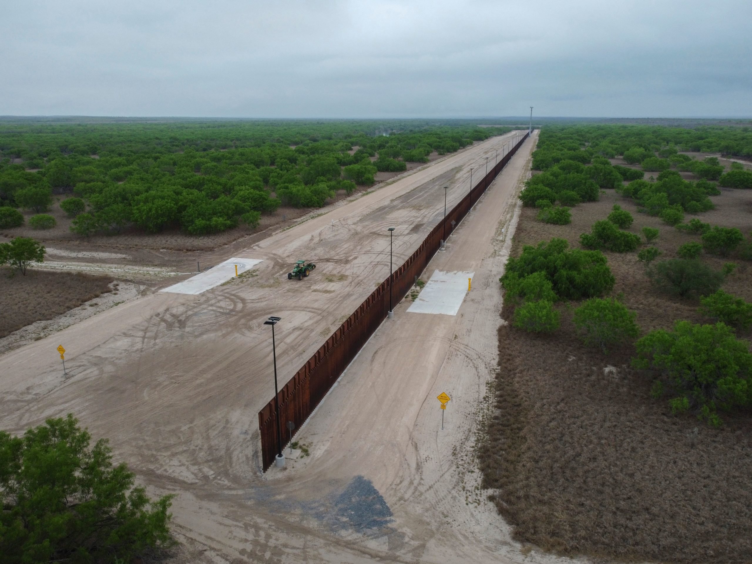 A photo taken on March 30, 2021 shows a general view of an unfinished section of a border wall that former US president Donald Trump tried to build near the southern Texas border city of Roma. - The 11,000 inhabitants of the Texas border town Roma have been living with illegal immigrants for decades. Many have mixed feelings about the new arrivals: empathy and compassion on the one hand - especially since many of their family members also arrived in the United States illegally - but also concern and fear about the growing number of migrants in recent months. Sometimes 500 per night, many of them families or unaccompanied minors. (Photo by Ed JONES / AFP) (Photo by ED JONES/AFP via Getty Images)