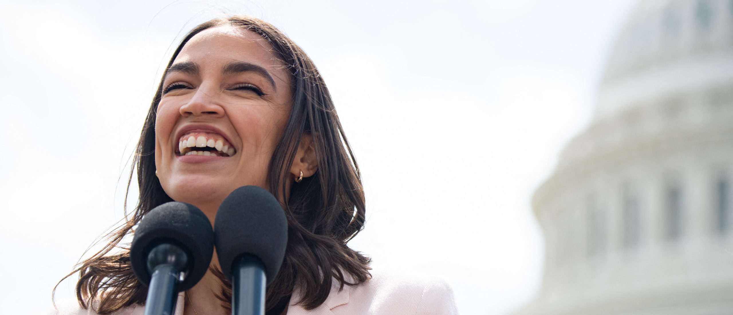 US Representative Alexandria Ocasio-Cortez, Democrat of New York, attends a press conference about a postal banking pilot program outside the US Capitol in Washington, DC, April 15, 2021. (Photo by SAUL LOEB / AFP) (Photo by SAUL LOEB/AFP via Getty Images)
